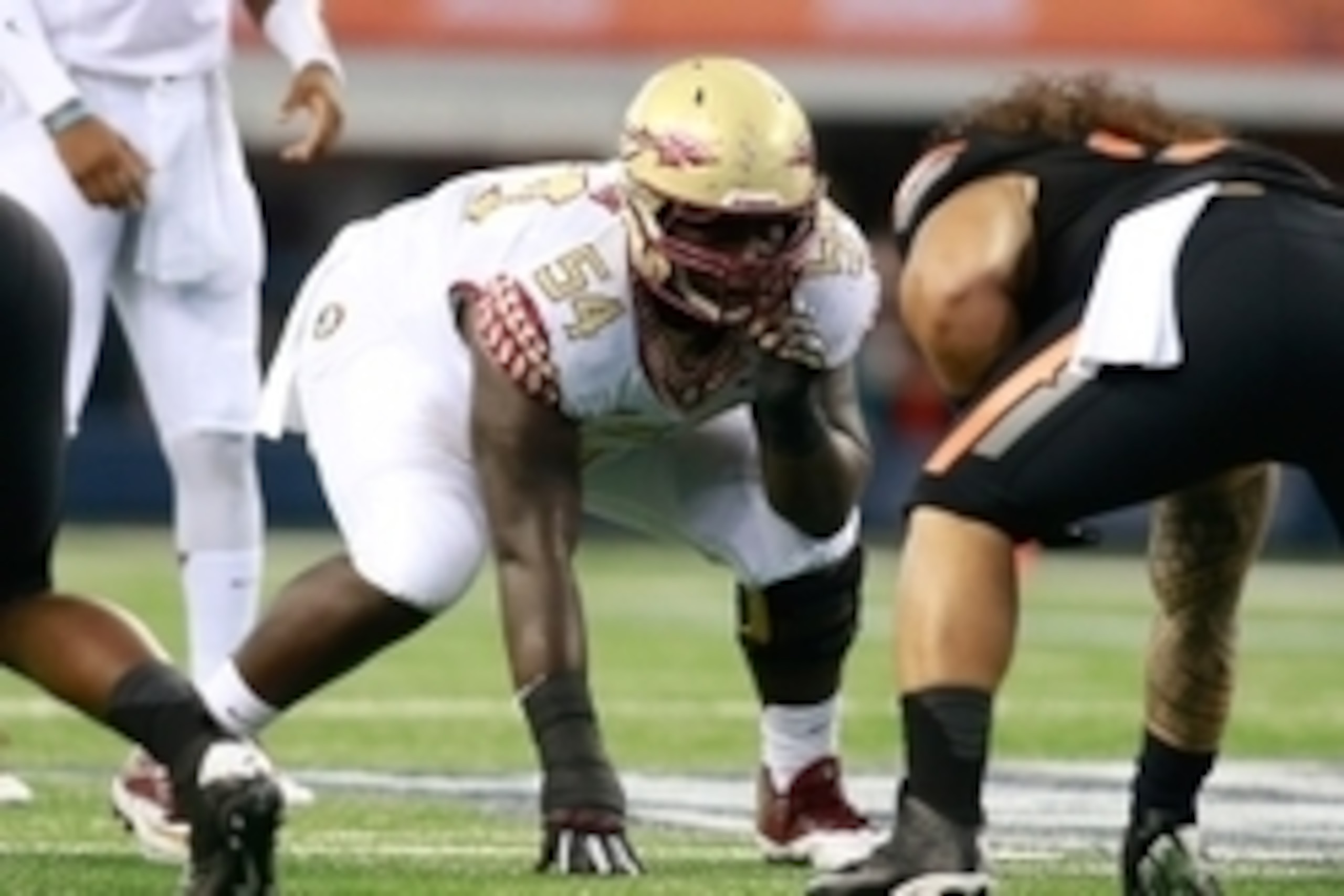Aug 30, 2014; Arlington, TX, USA; Florida State Seminoles guard Tre' Jackson (54) on the line of scrimmage against the Oklahoma State Cowboys  at AT&T Stadium. Florida State beat Oklahoma State 37-31. Mandatory Credit: Tim Heitman-USA TODAY Sports