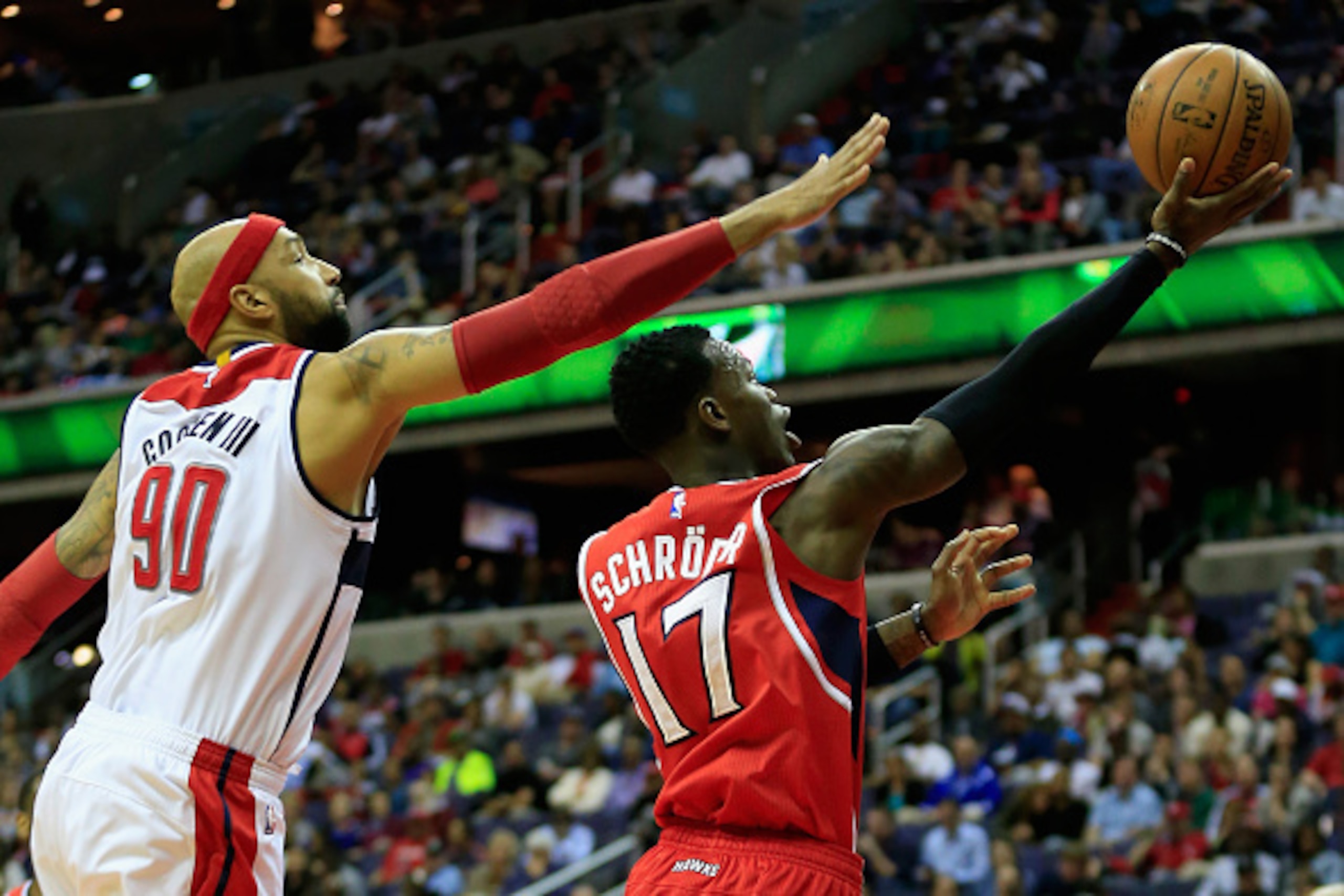 WASHINGTON, DC - APRIL 12: Dennis Schroder #17 of the Atlanta Hawks puts up a shot in front of Drew Gooden #90 of the Washington Wizards in the second half at Verizon Center on April 12, 2015 in Washington, DC. NOTE TO USER: User expressly acknowledges an WASHINGTON, DC - APRIL 12: Dennis Schroder #17 of the Atlanta Hawks puts up a shot in front of Drew Gooden #90 of the Washington Wizards in the second half at Verizon Center on April 12, 2015 in Washington, DC. NOTE TO USER: User expressly acknowledges an