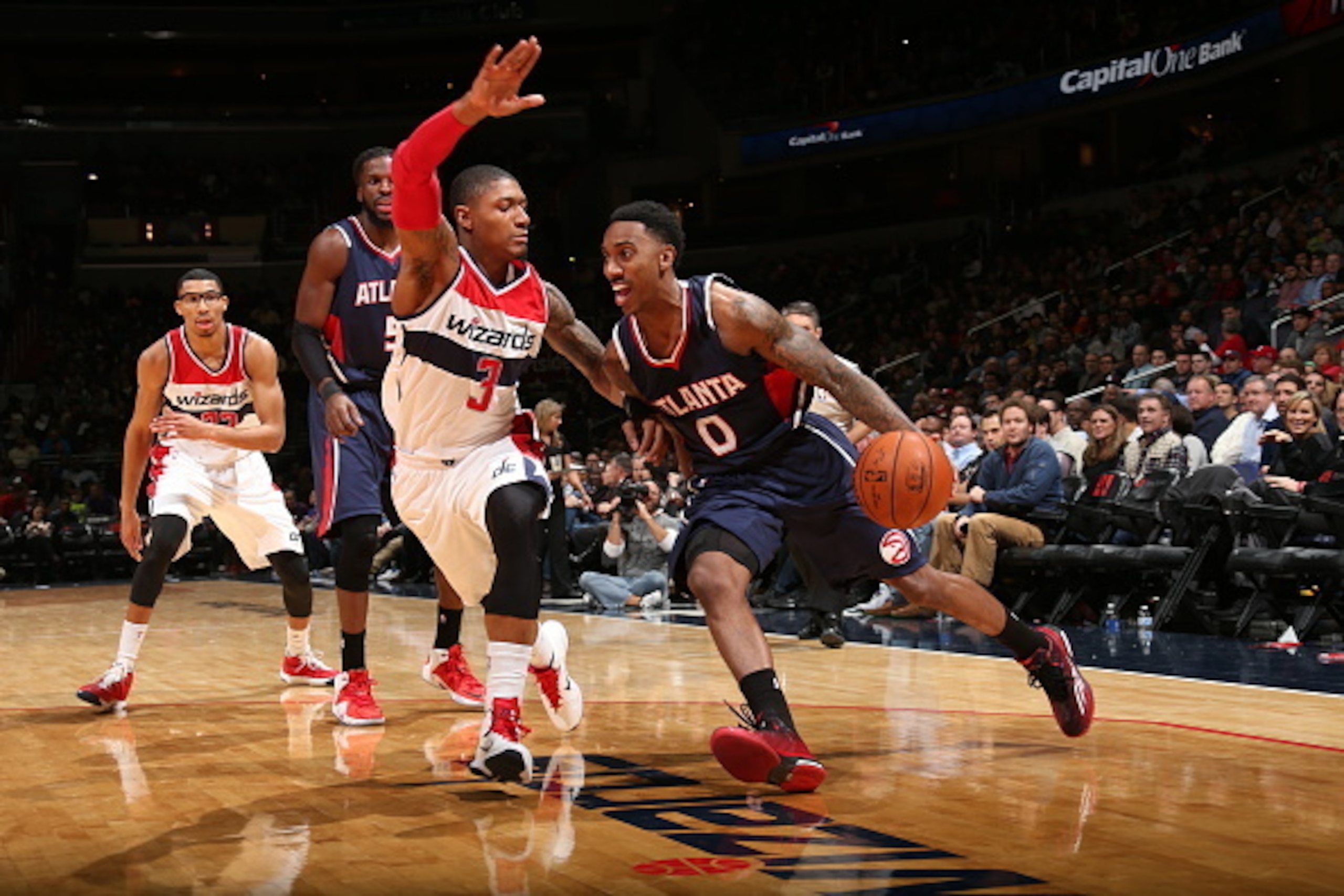 WASHINGTON, DC - NOVEMBER 25: Jeff Teague #0 of the Atlanta Hawks drives to the basket against Bradley Beal #3 of the Washington Wizards on November 25, 2014 at the Verizon Center in Washington, DC. NOTE TO USER: User expressly acknowledges and agrees th WASHINGTON, DC - NOVEMBER 25: Jeff Teague #0 of the Atlanta Hawks drives to the basket against Bradley Beal #3 of the Washington Wizards on November 25, 2014 at the Verizon Center in Washington, DC. NOTE TO USER: User expressly acknowledges and agrees th