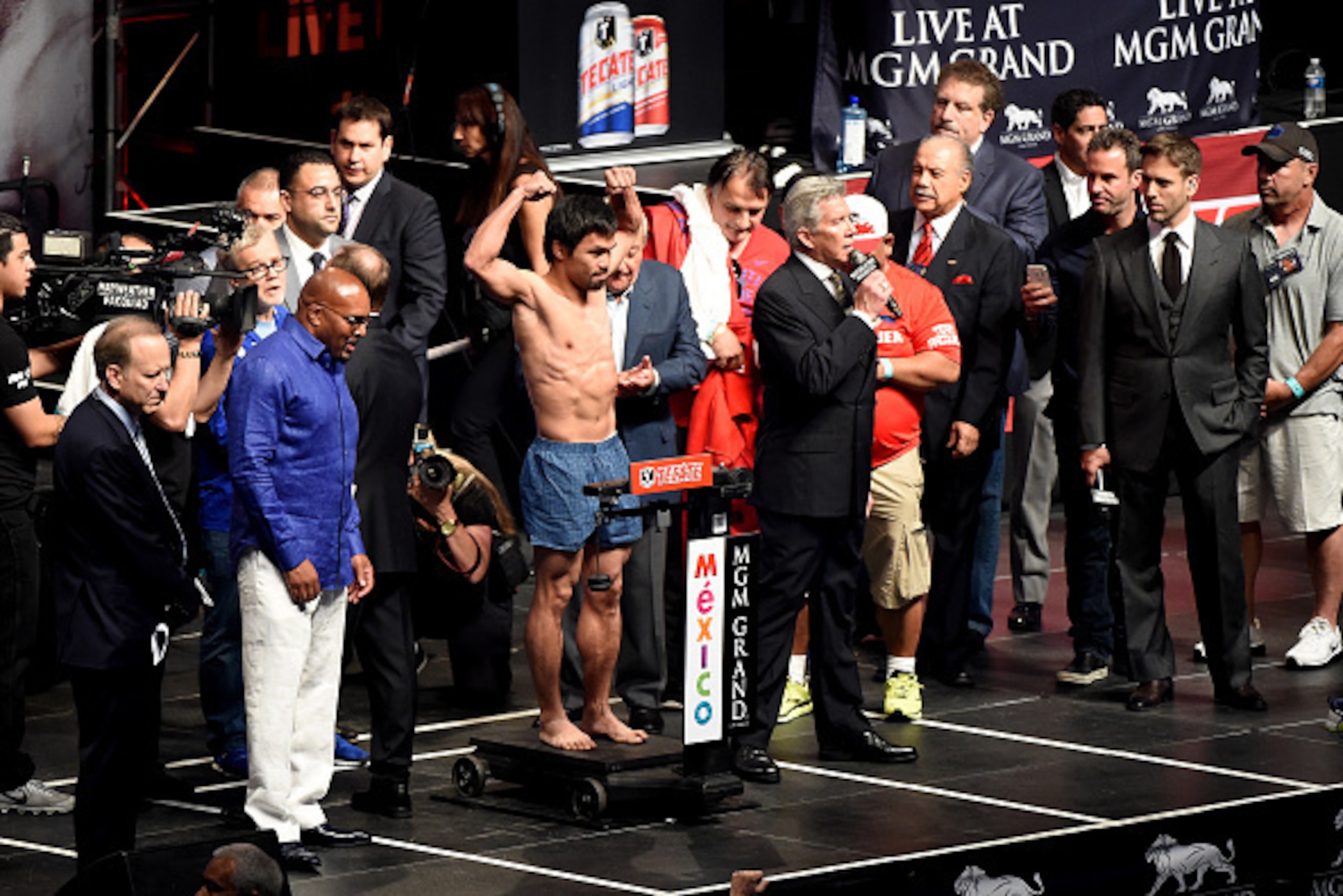 LAS VEGAS, NV - MAY 01:  Manny Pacquiao poses on the scale during his official weigh-in on May 1, 2015 at MGM Grand Garden Arena in Las Vegas, Nevada. Pacquiao will face Floyd Mayweather Jr. in a welterweight unification bout on May 2, 2015 in Las Vegas. 