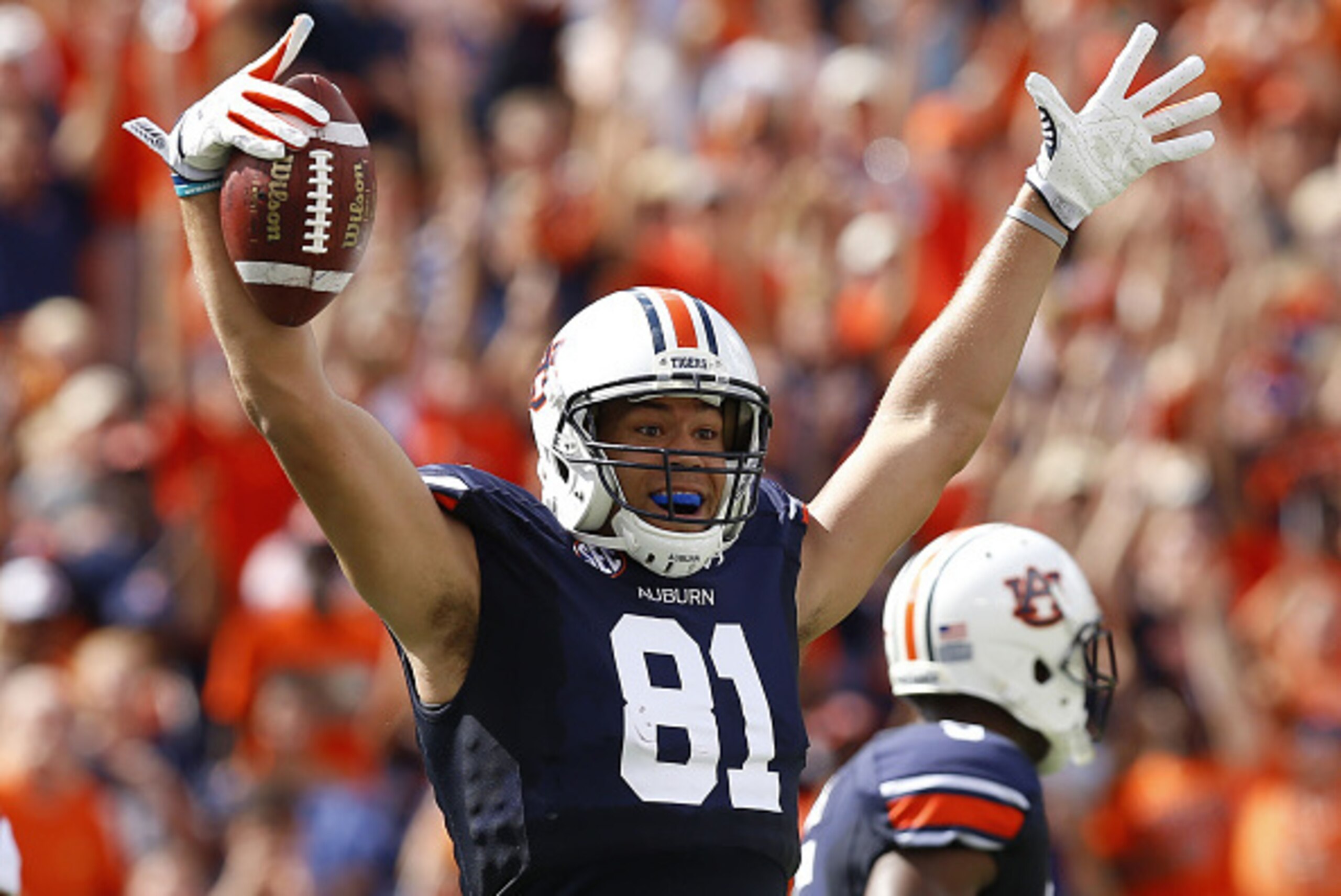 AUBURN, AL - AUGUST 30:  Tight end C.J. Uzomah #81 of the Auburn Tigers celebrates after a reception during the game against the Arkansas Razorbacks at Jordan Hare Stadium on August 30, 2014 in Auburn, Alabama.  (Photo by Mike Zarrilli/Getty Images)