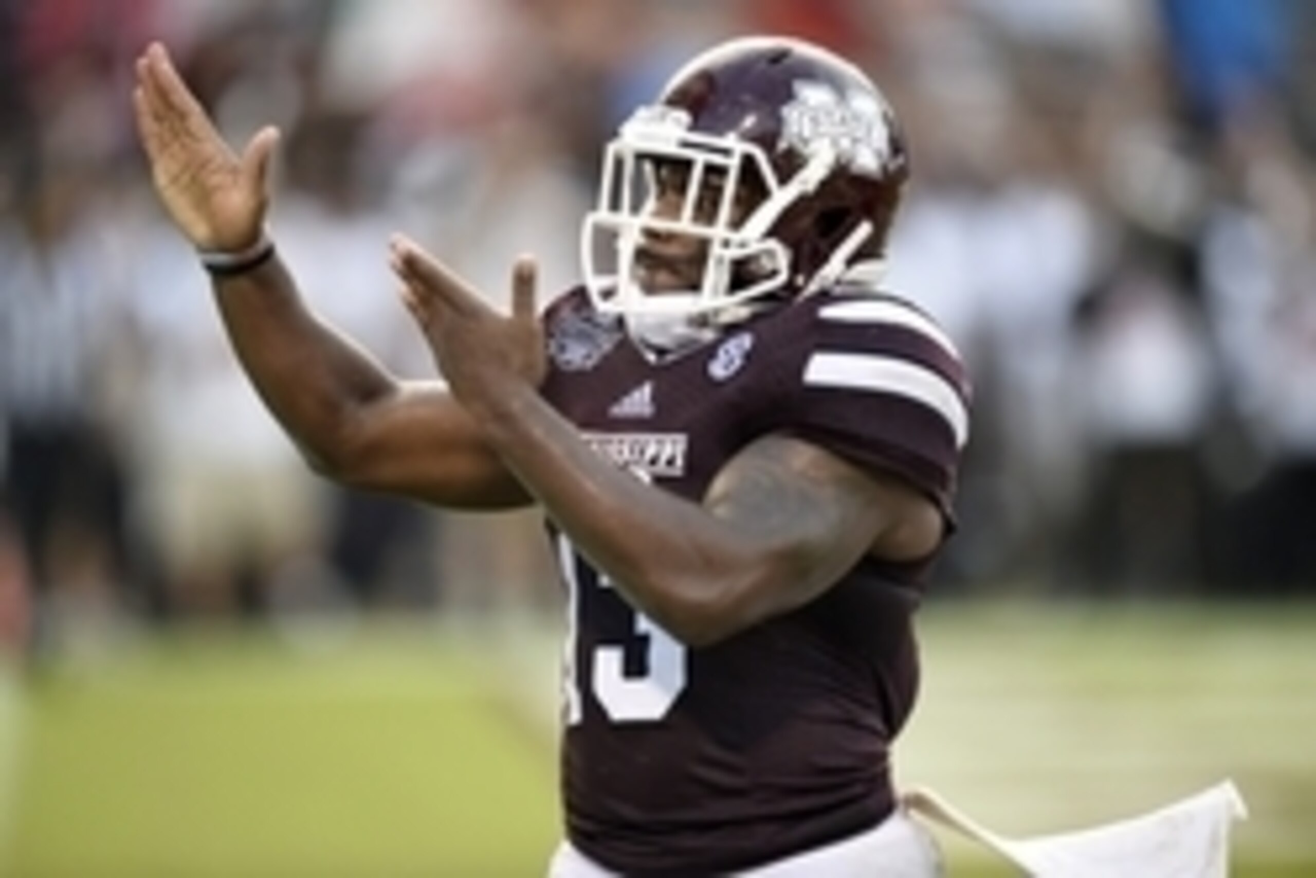 Oct 11, 2014; Starkville, MS, USA; Mississippi State Bulldogs running back Josh Robinson (13) gestures to the crowd as he celebrates his touchdown against the Auburn Tigers during the fourth quarter at Davis Wade Stadium. Mandatory Credit: John David Merc