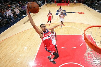 WASHINGTON, DC - APRIL 3: Otto Porter Jr. #22 of the Washington Wizards  shoots against Ricardo Ledo #11 of the New York Knicks during a game at the Verizon Center on April 3, 2015 in Washington, DC. NOTE TO USER: User expressly acknowledges and agrees th