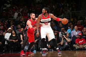 WASHINGTON, DC - APRIL 26:  Nene Hilario #42 of the Washington Wizards handles the ball against Jonas Valanciunas #17 of the Toronto Raptors in Game Four of the Eastern Conference Quarterfinals during the 2015 NBA Playoffs on April 26, 2015 at the Verizon