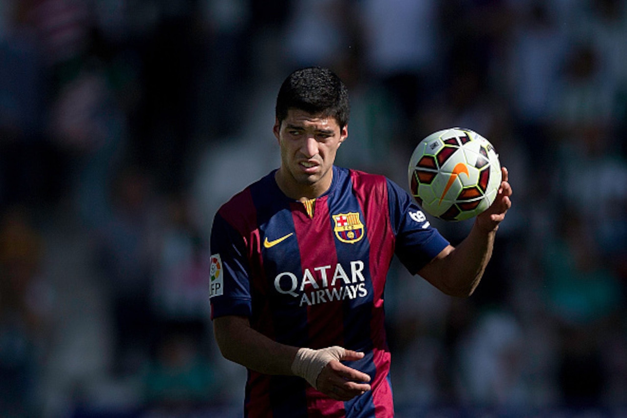 CORDOBA, SPAIN - MAY 02:  Luis Suarez of FC Barcelona holds the ball given by his hack trick after the La Liga match between Cordoba CF and Barcelona FC at El Arcangel stadium on May 2, 2015 in Cordoba, Spain.  (Photo by Gonzalo Arroyo Moreno/Getty Images