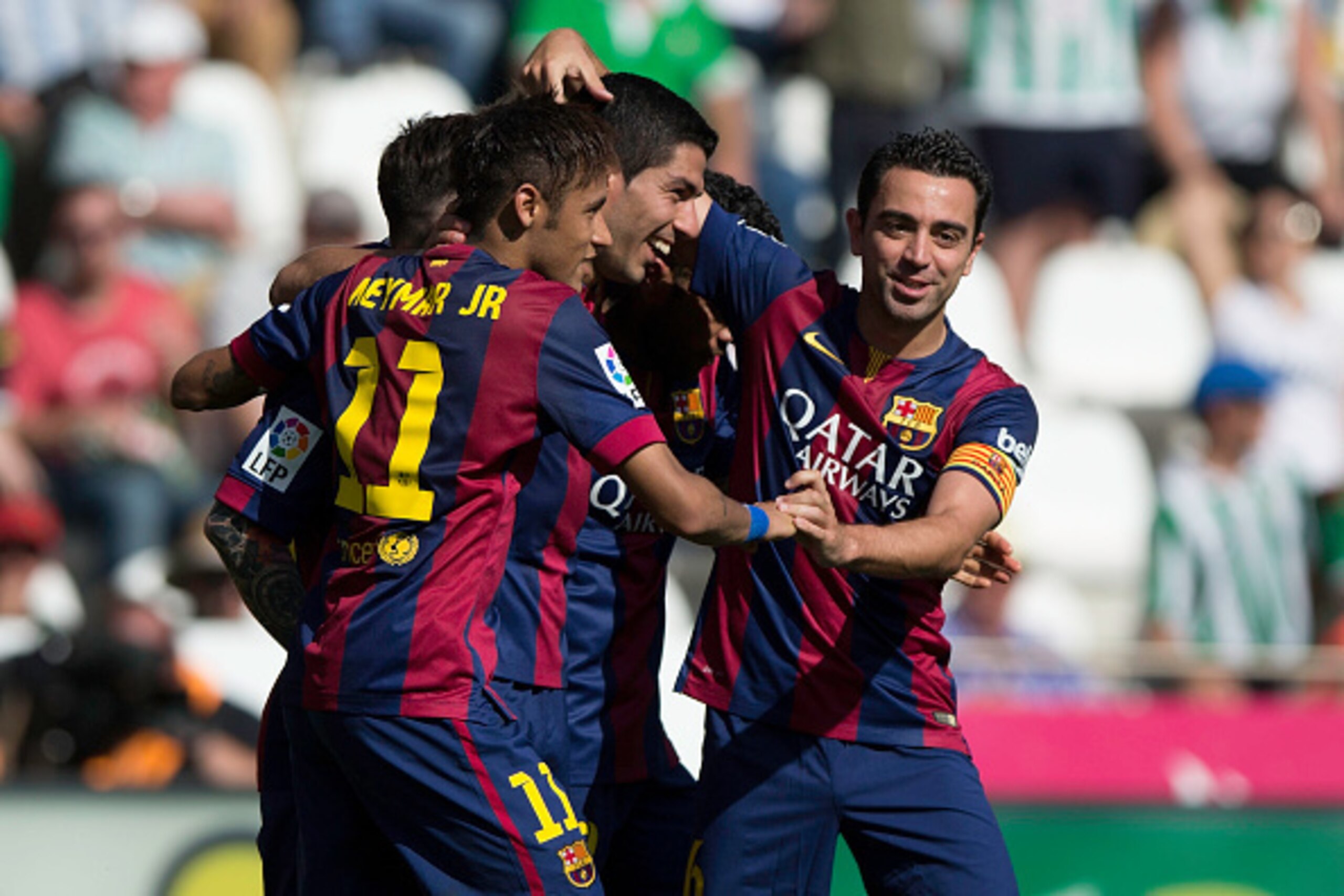 CORDOBA, SPAIN - MAY 02:  Luis Suarez (2ndL) of FC Barcelona celebrates scoring their eight goal with teammates Neymar JR. (L) and Xavi Hernandez (R) during the La Liga match between Cordoba CF and Barcelona FC at El Arcangel stadium on May 2, 2015 in Cor