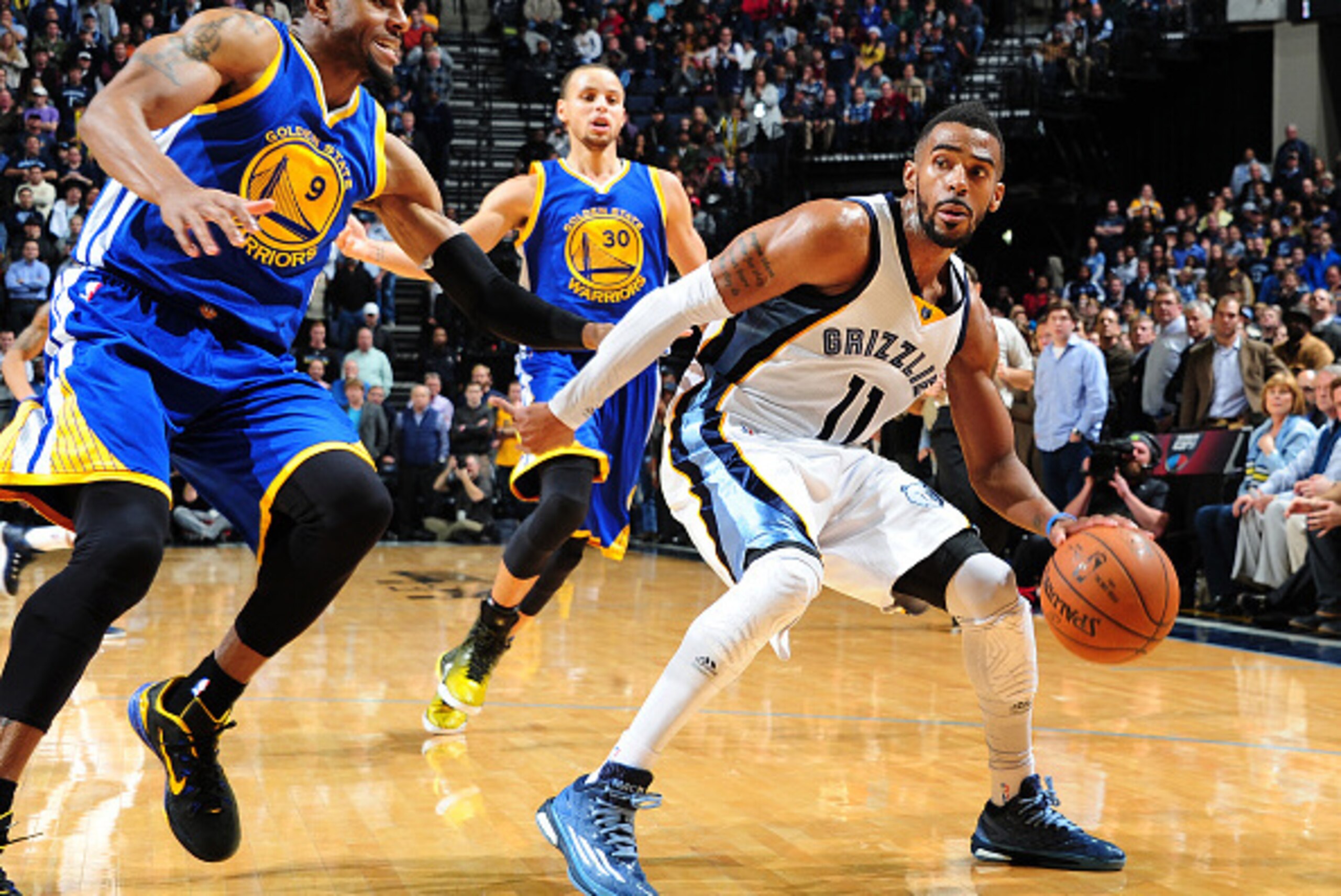 MEMPHIS, TN - DECEMBER 16: Mike Conley #11 of the Memphis Grizzlies drives against the Golden State Warriors on December 16, 2014 at the FedEx Forum in Memphis, Tennessee. NOTE TO USER: User expressly acknowledges and agrees that, by downloading and/or u MEMPHIS, TN - DECEMBER 16: Mike Conley #11 of the Memphis Grizzlies drives against the Golden State Warriors on December 16, 2014 at the FedEx Forum in Memphis, Tennessee. NOTE TO USER: User expressly acknowledges and agrees that, by downloading and/or u