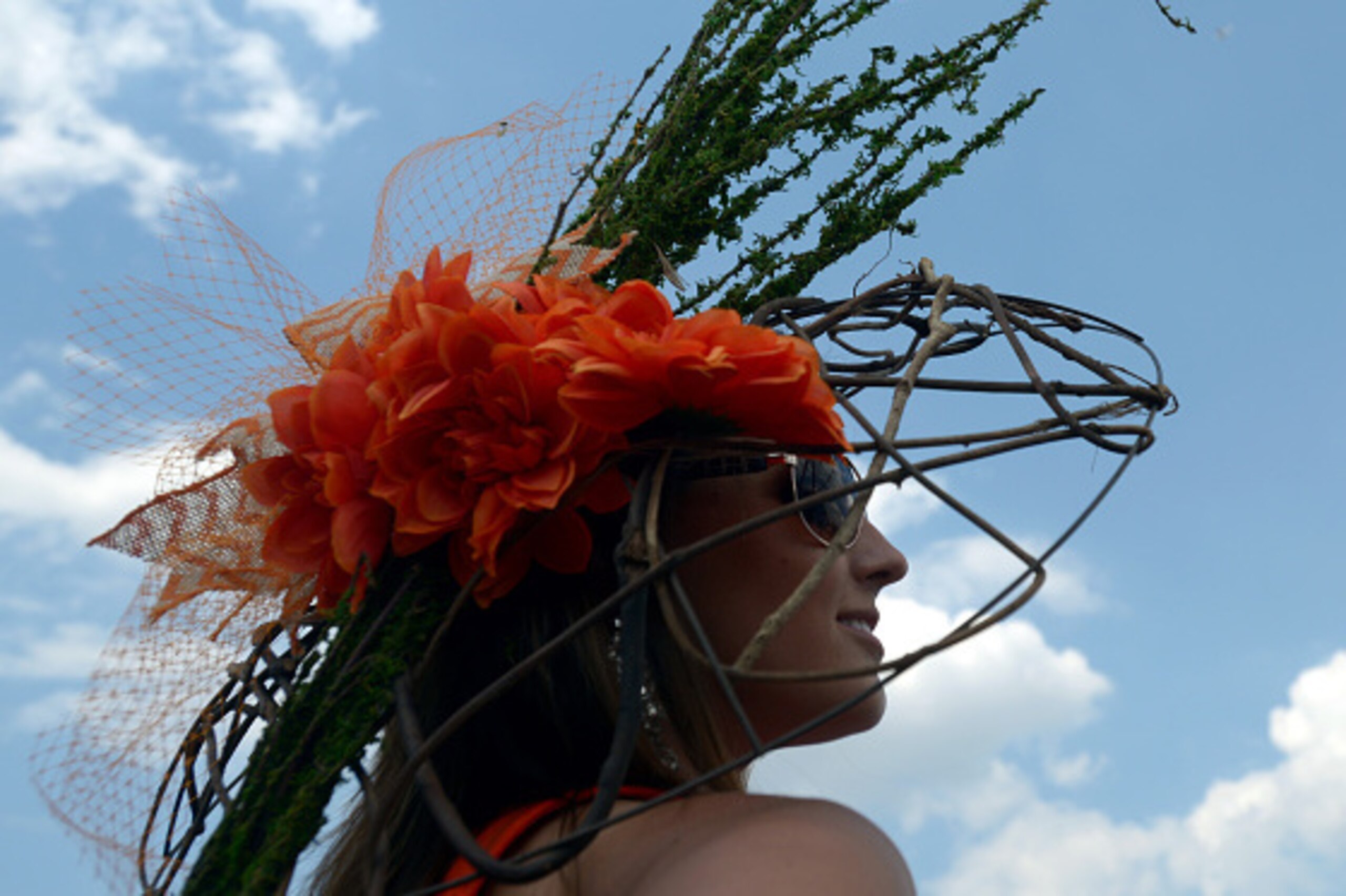 LOUISVILLE, KY - MAY 02:  A woman wearing a festive hat looks on prior to the 141st running of the Kentucky Derby at Churchill Downs on May 2, 2015 in Louisville, Kentucky.  (Photo by Dylan Buell/Getty Images)