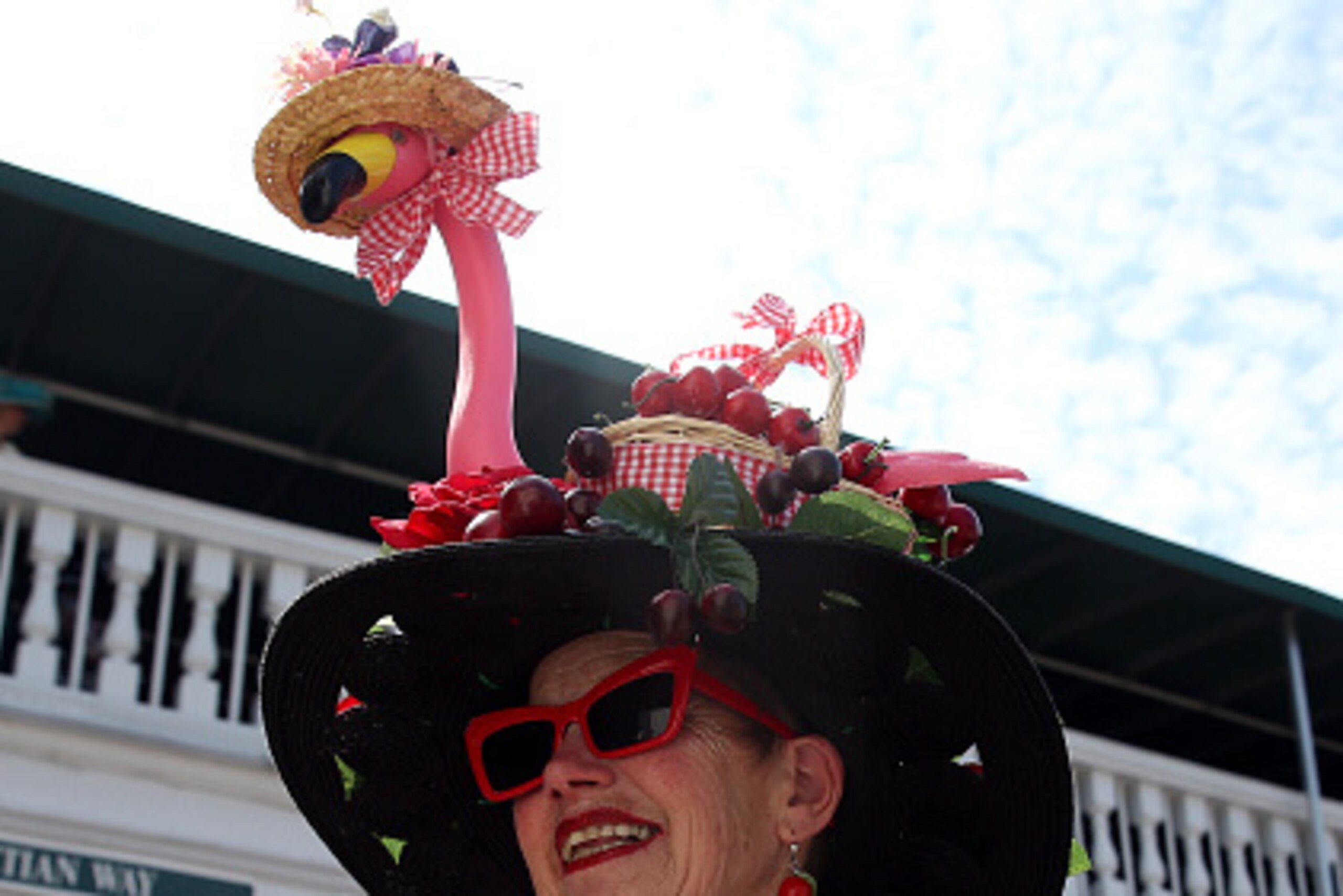 LOUISVILLE, KY - MAY 02:  A woman wearing a festive hat looks on prior to the 141st running of the Kentucky Derby at Churchill Downs on May 2, 2015 in Louisville, Kentucky.  (Photo by Andy Lyons/Getty Images)