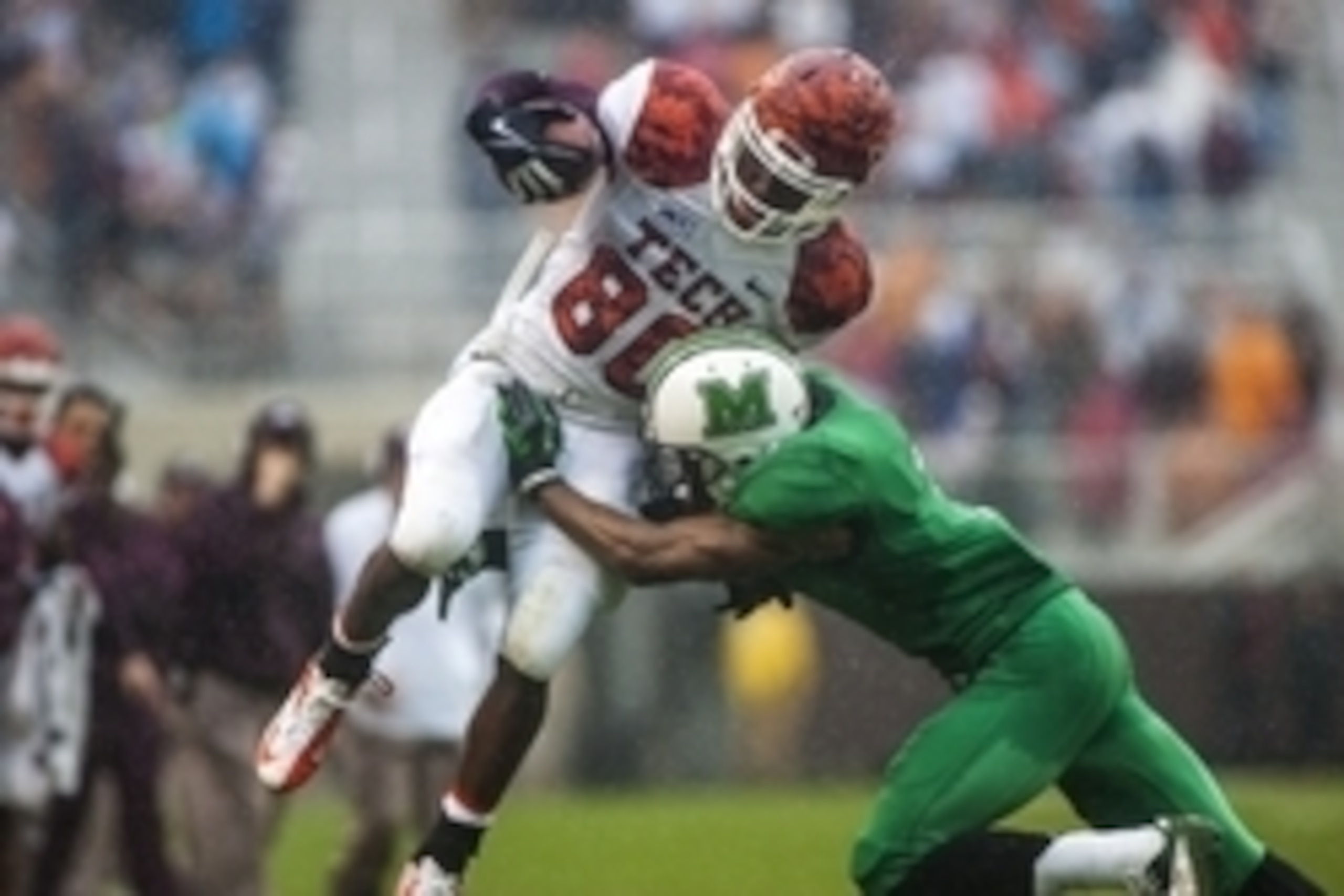 Sep 21, 2013; Blacksburg, VA, USA; Virginia Tech Hokies wide receiver Demitri Knowles (80) is tackled by Marshall Thundering Herd defensive back Darryl Roberts (7) during the second half at Lane Stadium. Mandatory Credit: Peter Casey-USA TODAY Sports