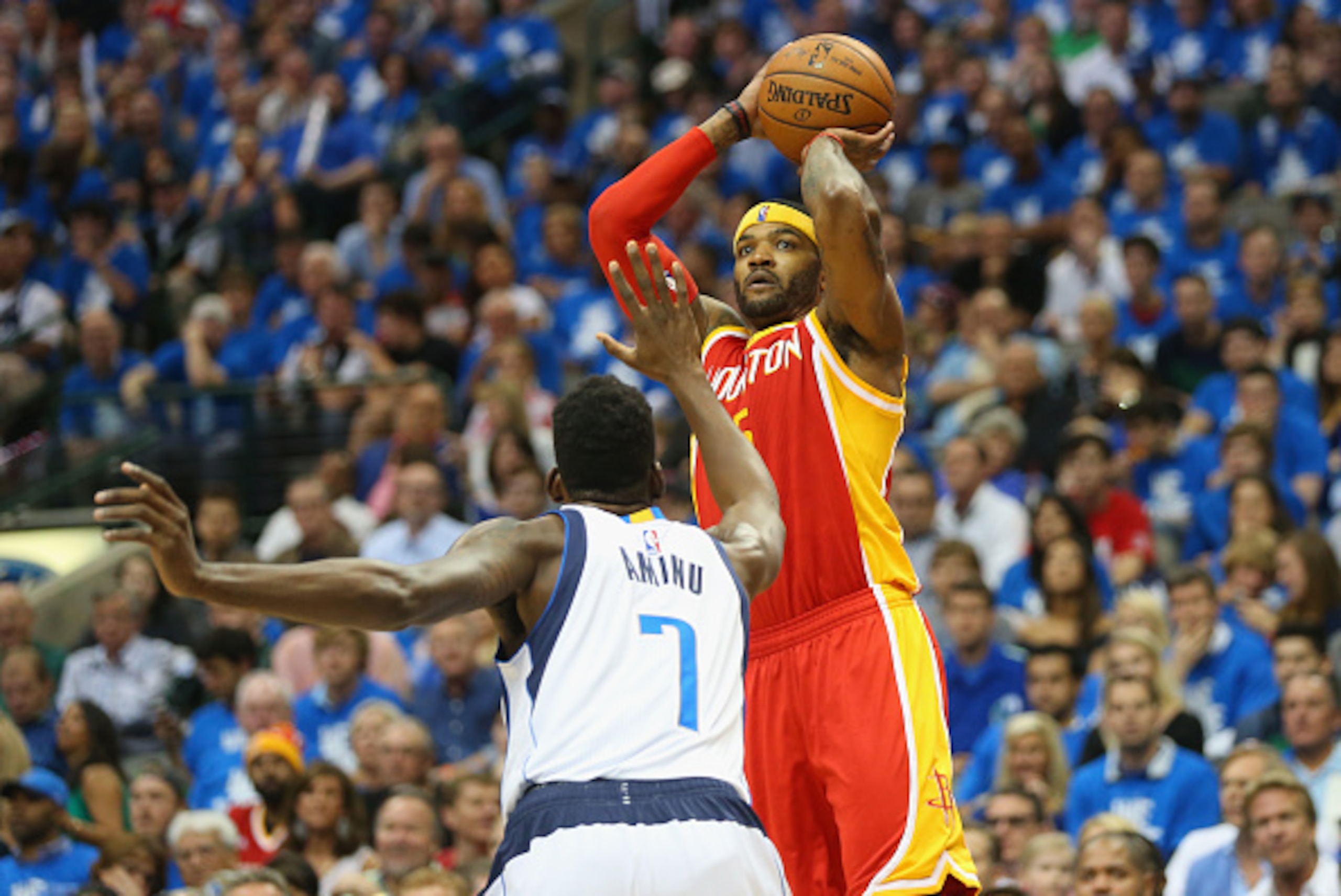DALLAS, TX - APRIL 24: Josh Smith #5 of the Houston Rockets takes a shot against Al-Farouq Aminu #7 of the Dallas Mavericks during Game Three of the Western Conference quarterfinals of the 2015 NBA Playoffs at American Airlines Center on April 24, 2015 i DALLAS, TX - APRIL 24: Josh Smith #5 of the Houston Rockets takes a shot against Al-Farouq Aminu #7 of the Dallas Mavericks during Game Three of the Western Conference quarterfinals of the 2015 NBA Playoffs at American Airlines Center on April 24, 2015 i