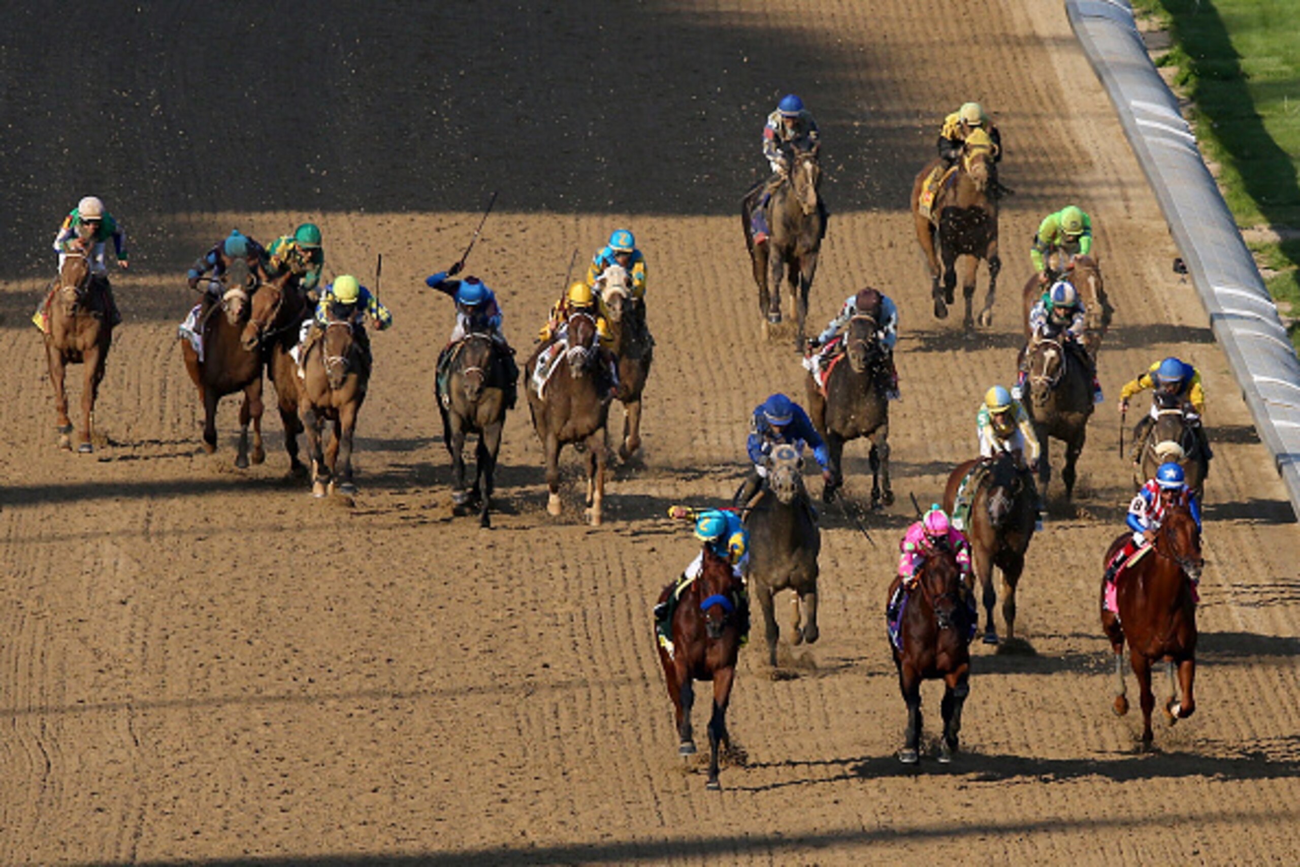 LOUISVILLE, KY - MAY 02: American Pharoah #18, ridden by Victor Espinoza, Firing Line #10, ridden by Gary Stevens, and Dortmund #8, ridden by Martin Garcia, lead the field as they head for the finish line during the 141st running of the Kentucky Derby at LOUISVILLE, KY - MAY 02: American Pharoah #18, ridden by Victor Espinoza, Firing Line #10, ridden by Gary Stevens, and Dortmund #8, ridden by Martin Garcia, lead the field as they head for the finish line during the 141st running of the Kentucky Derby at