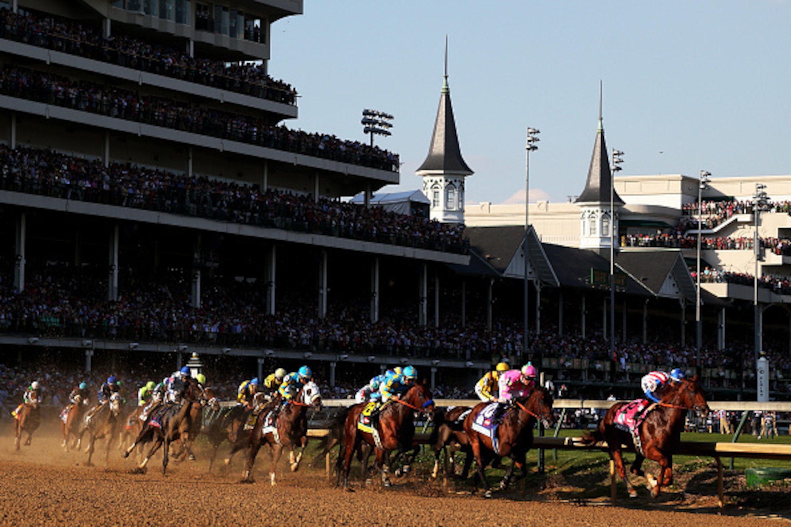 LOUISVILLE, KY - MAY 02: The field races through turn one at the start of the 141st running of the Kentucky Derby at Churchill Downs on May 2, 2015 in Louisville, Kentucky. (Photo by Chris Graythen/Getty Images) LOUISVILLE, KY - MAY 02: The field races through turn one at the start of the 141st running of the Kentucky Derby at Churchill Downs on May 2, 2015 in Louisville, Kentucky. (Photo by Chris Graythen/Getty Images)
