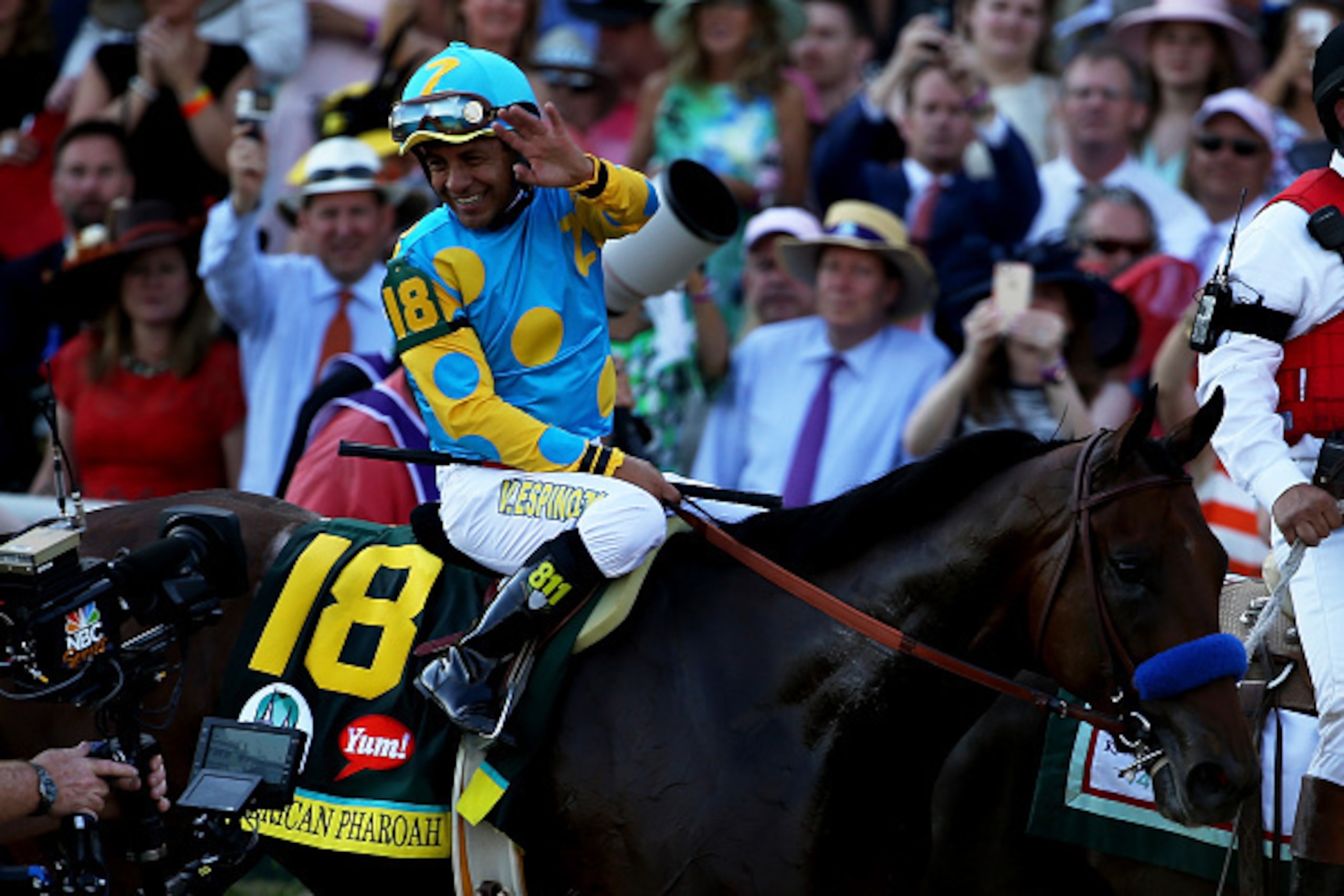 LOUISVILLE, KY - MAY 02:  Jockey Victor Espinoza celebrates atop of American Pharoah #18 on his way to winners circle after winning the 141st running of the Kentucky Derby at Churchill Downs on May 2, 2015 in Louisville, Kentucky.  (Photo by Andy Lyons/Ge