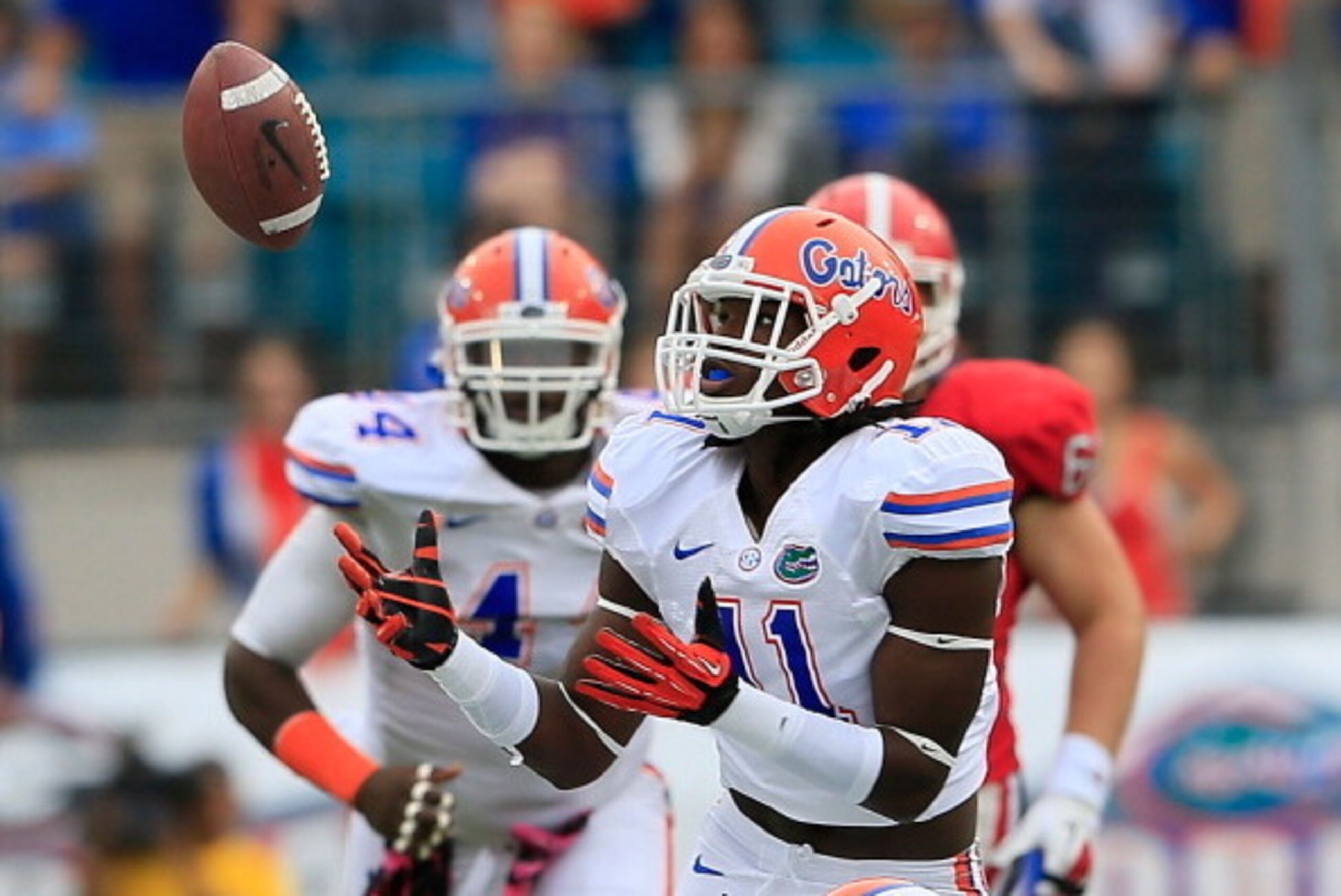 JACKSONVILLE, FL - OCTOBER 27:  Neiron Ball #11 of the Florida Gators attempts an interception during the game against the Georgia Bulldogs at EverBank Field on October 27, 2012 in Jacksonville, Florida.  (Photo by Sam Greenwood/Getty Images)