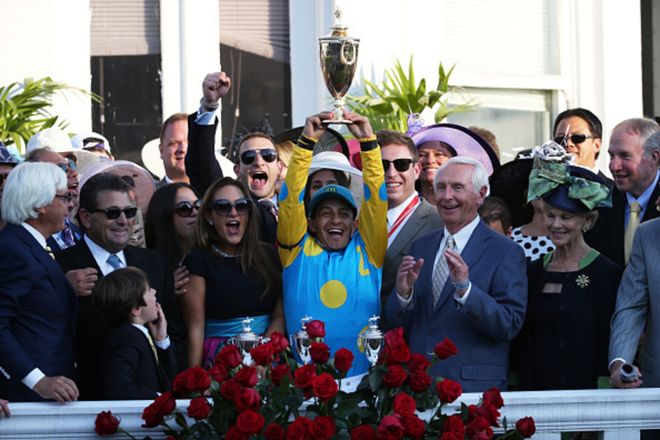 LOUISVILLE, KY - MAY 02:  Jockey Victor Espinoza of American Pharoah #18 celebrates with the trophy in winners circle after winning the 141st running of the Kentucky Derby at Churchill Downs on May 2, 2015 in Louisville, Kentucky.  (Photo by Andy Lyons/Ge