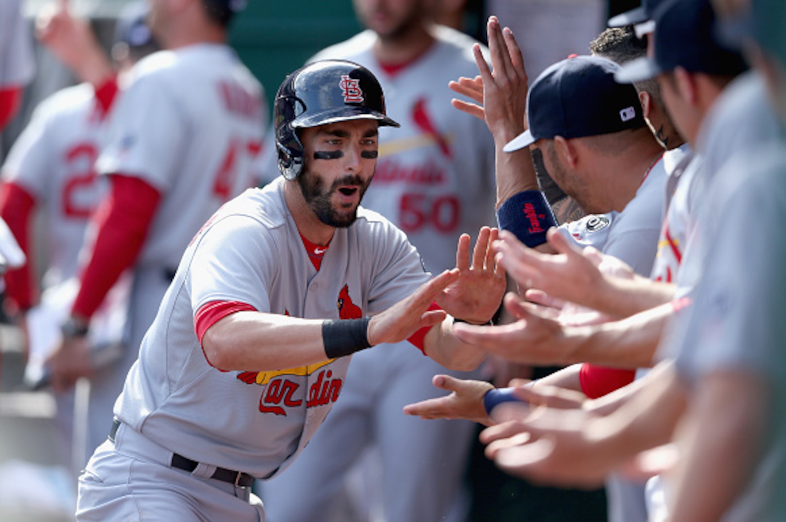 CINCINNATI, OH - APRIL 12: Matt Carpenter #13 of the St. Louis Cardinals celebrates with teammates after hitting a homerun in the 11th inning during the game against the Cincinnati Reds at Great American Ball Park on April 12, 2015 in Cincinnati, Ohio. CINCINNATI, OH - APRIL 12: Matt Carpenter #13 of the St. Louis Cardinals celebrates with teammates after hitting a homerun in the 11th inning during the game against the Cincinnati Reds at Great American Ball Park on April 12, 2015 in Cincinnati, Ohio.