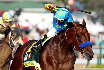 LOUISVILLE, KY - MAY 02:  American Pharoah #18, ridden by Victor Espinoza, comes out of turn 4 during the 141st running of the Kentucky Derby at Churchill Downs on May 2, 2015 in Louisville, Kentucky.  (Photo by Andy Lyons/Getty Images)
