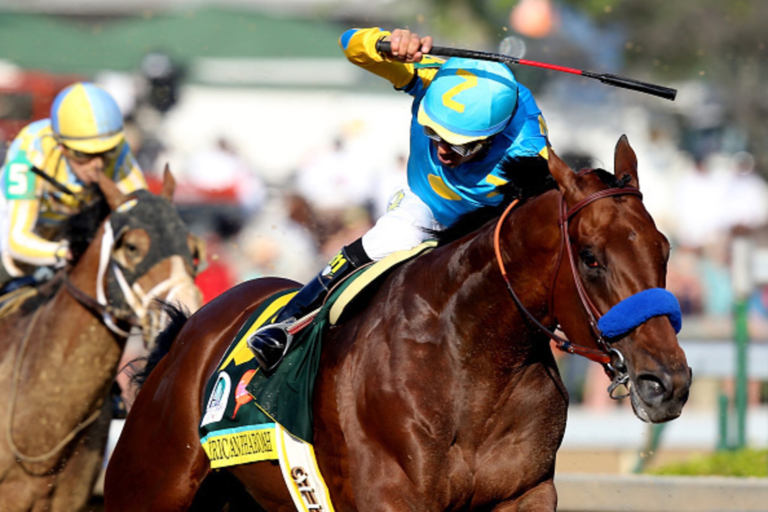 LOUISVILLE, KY - MAY 02:  American Pharoah #18, ridden by Victor Espinoza, comes out of turn 4 during the 141st running of the Kentucky Derby at Churchill Downs on May 2, 2015 in Louisville, Kentucky.  (Photo by Andy Lyons/Getty Images)