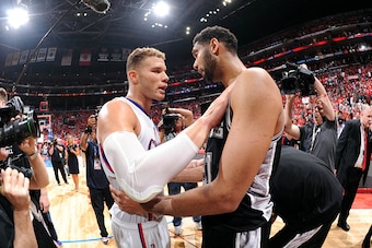LOS ANGELES, CA - MAY 2: Blake Griffin #32 of the Los Angeles Clippers and Tim Duncan #21 of the San Antonio Spurs hug after Game Seven of the Western Conference Quarterfinals during the 2015 NBA Playoffs on May  2, 2015 at STAPLES Center in Los Angeles, 