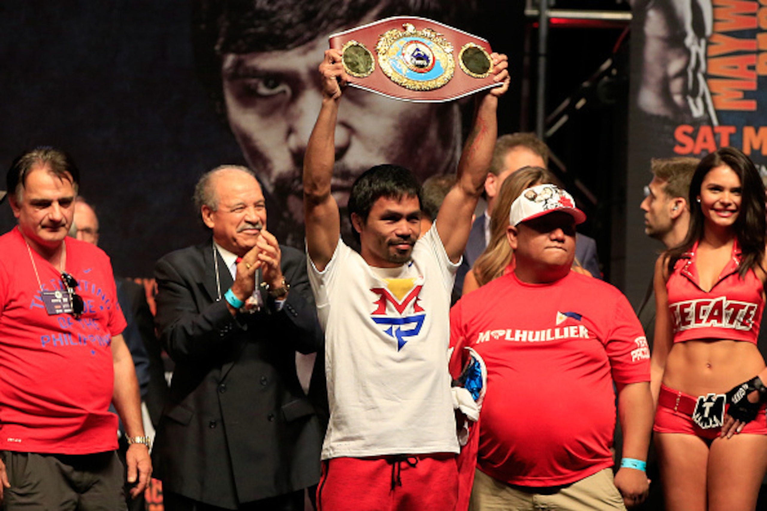 LAS VEGAS, NV - MAY 01:  Manny Pacquiao holds up the WBO belt during his official weigh-in on May 1, 2015 at MGM Grand Garden Arena in Las Vegas, Nevada. Pacquiao will face Floyd Mayweather Jr. in a welterweight unification bout on May 2, 2015 in Las Vega
