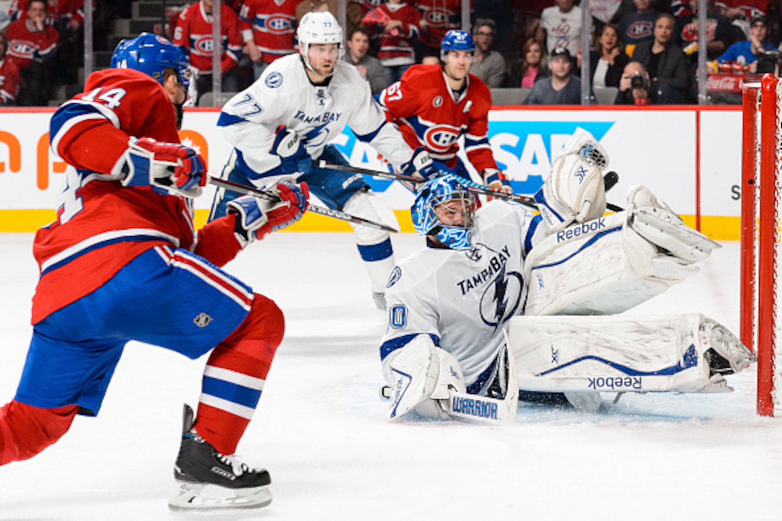 MONTREAL, QC - MAY 01:  Goaltender Ben Bishop #30 of the Tampa Bay Lightning makes a glove save on Tomas Plekanec #14 of the Montreal Canadiens in Game One of the Eastern Conference Semifinals during the 2015 NHL Stanley Cup Playoffs at the Bell Centre on