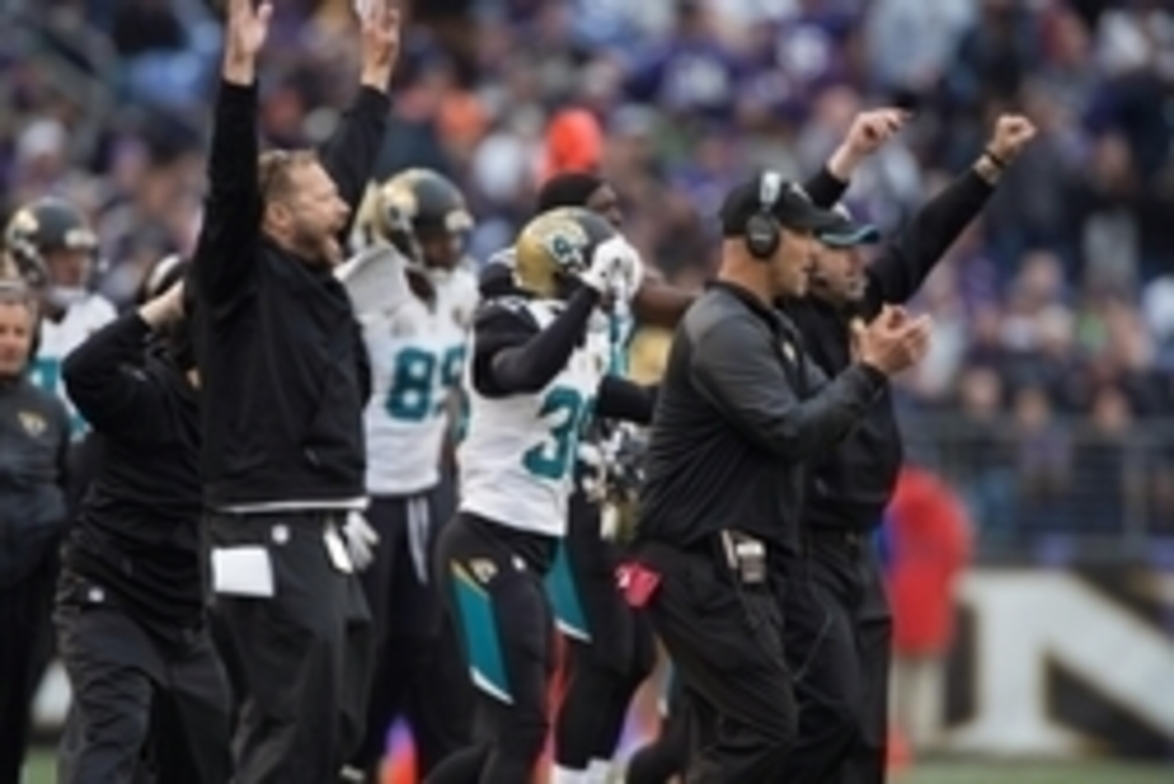 Dec 14, 2014; Baltimore, MD, USA; Jacksonville Jaguars head coach Gus Bradley (right) and the bench celebrate after Baltimore Ravens kicker Justin Tucker (9) missed a field goal during the third quarter at M&T Bank Stadium. Baltimore Ravens defeated Jacks