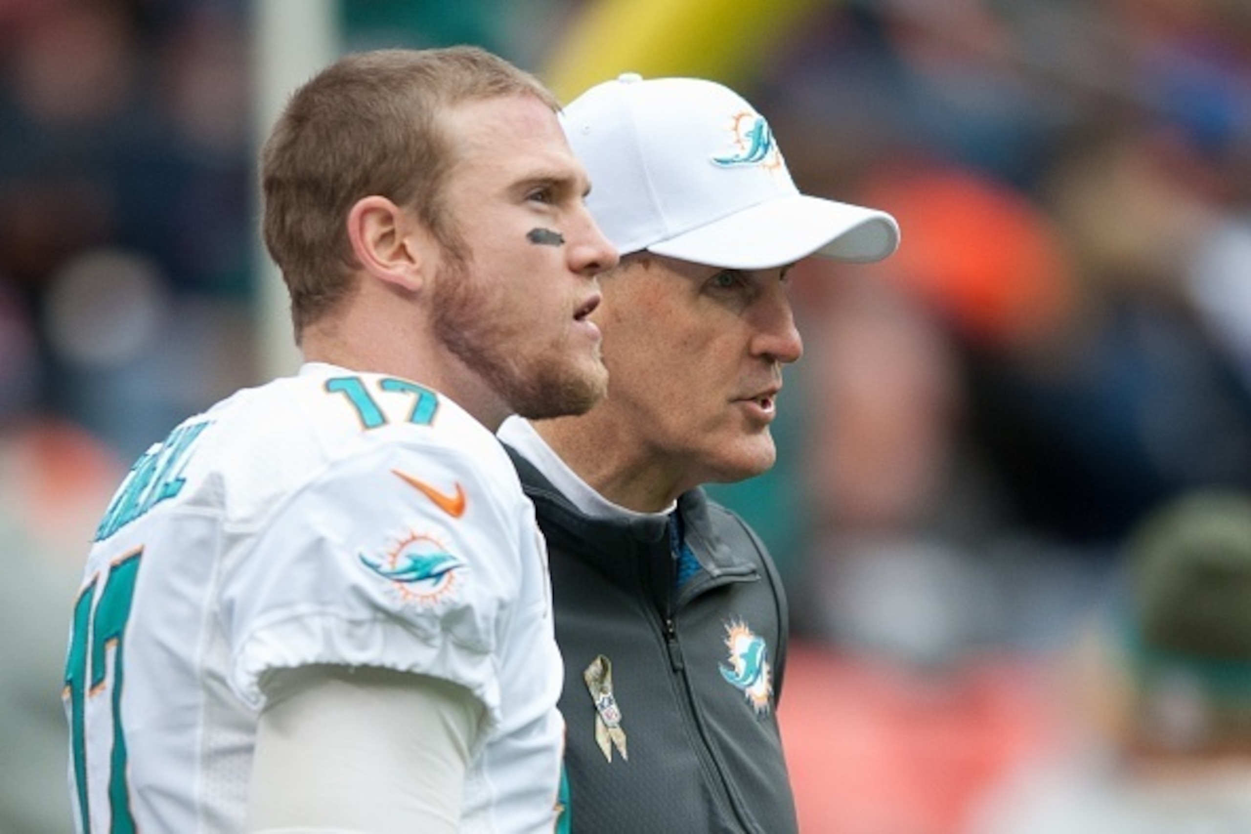DENVER, CO - NOVEMBER 23:  Head coach Joe Philbin of the Miami Dolphins has a word with quarterback Ryan Tannehill #17 before a game against the Denver Broncos at Sports Authority Field at Mile High on November 23, 2014 in Denver, Colorado.  (Photo by Dus