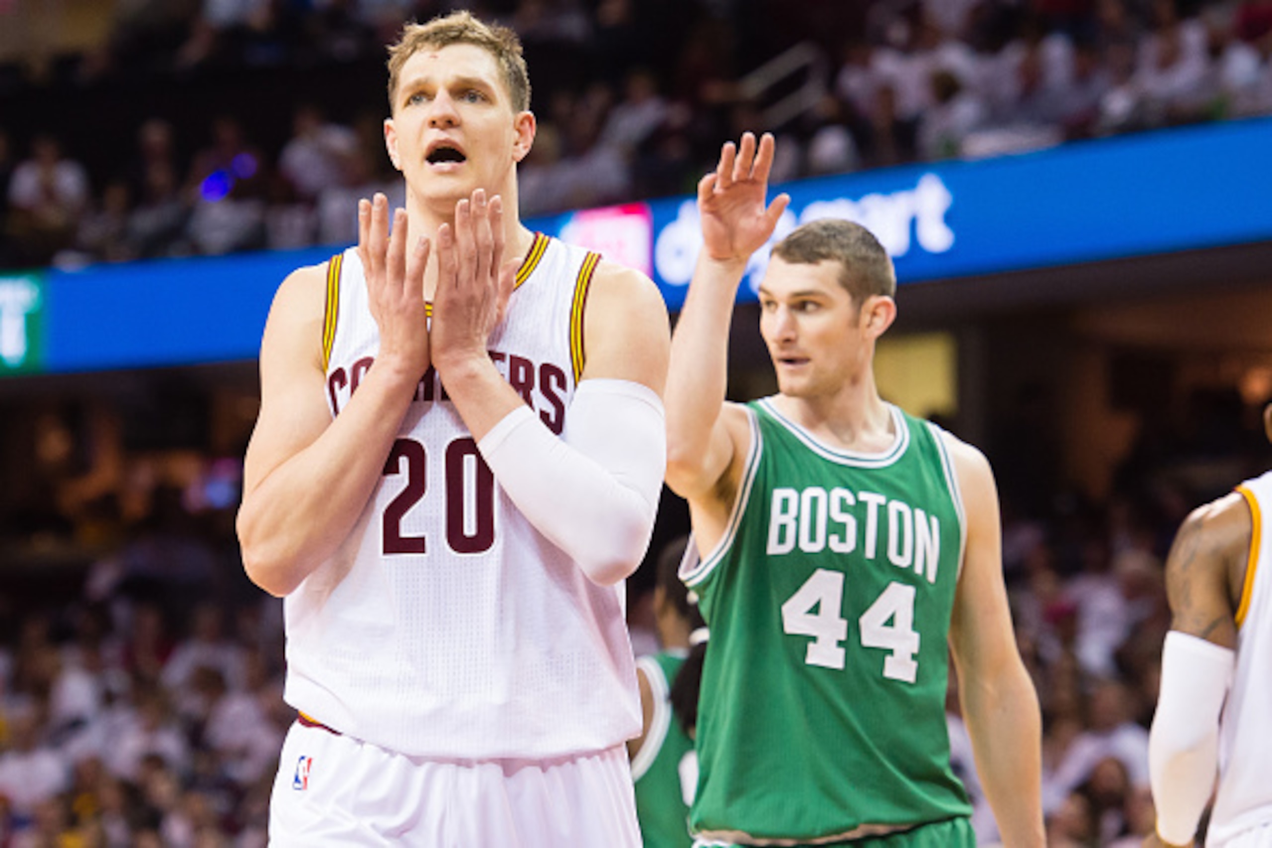 CLEVELAND, OH - APRIL 21: Timofey Mozgov #20 of the Cleveland Cavaliers reacts after being charged with fouling Tyler Zeller #44 of the Boston Celtics in the second half during Game Two in the Eastern Conference Quarterfinals of the 2015 NBA Playoffs at Q CLEVELAND, OH - APRIL 21: Timofey Mozgov #20 of the Cleveland Cavaliers reacts after being charged with fouling Tyler Zeller #44 of the Boston Celtics in the second half during Game Two in the Eastern Conference Quarterfinals of the 2015 NBA Playoffs at Q