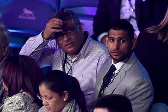 LAS VEGAS, NV - MAY 02:  Boxer Amir Khan (R) watches the Leo Santa Cruz against Jose Cayetano featherweight bout on May 2, 2015 at MGM Grand Garden Arena in Las Vegas, Nevada.  (Photo by Harry How/Getty Images)