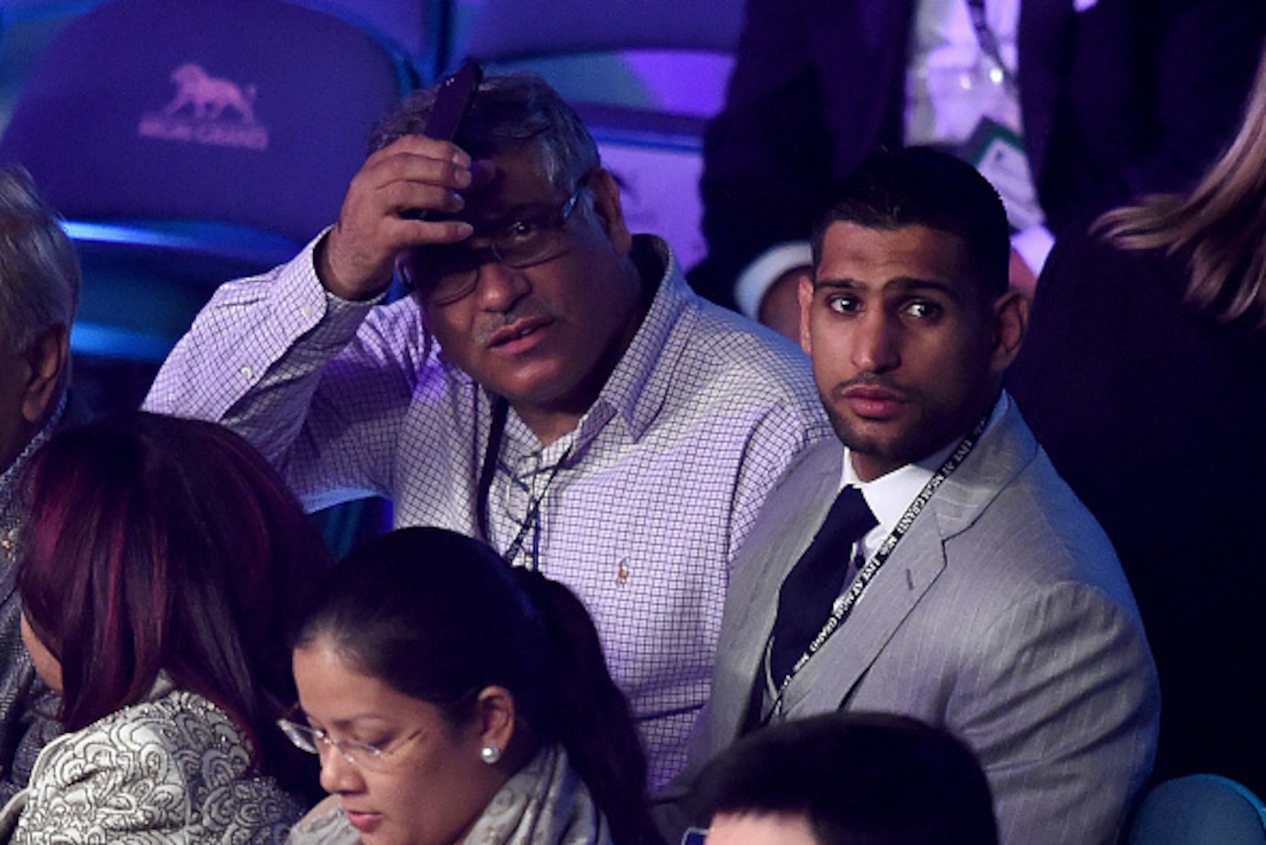 LAS VEGAS, NV - MAY 02:  Boxer Amir Khan (R) watches the Leo Santa Cruz against Jose Cayetano featherweight bout on May 2, 2015 at MGM Grand Garden Arena in Las Vegas, Nevada.  (Photo by Harry How/Getty Images)