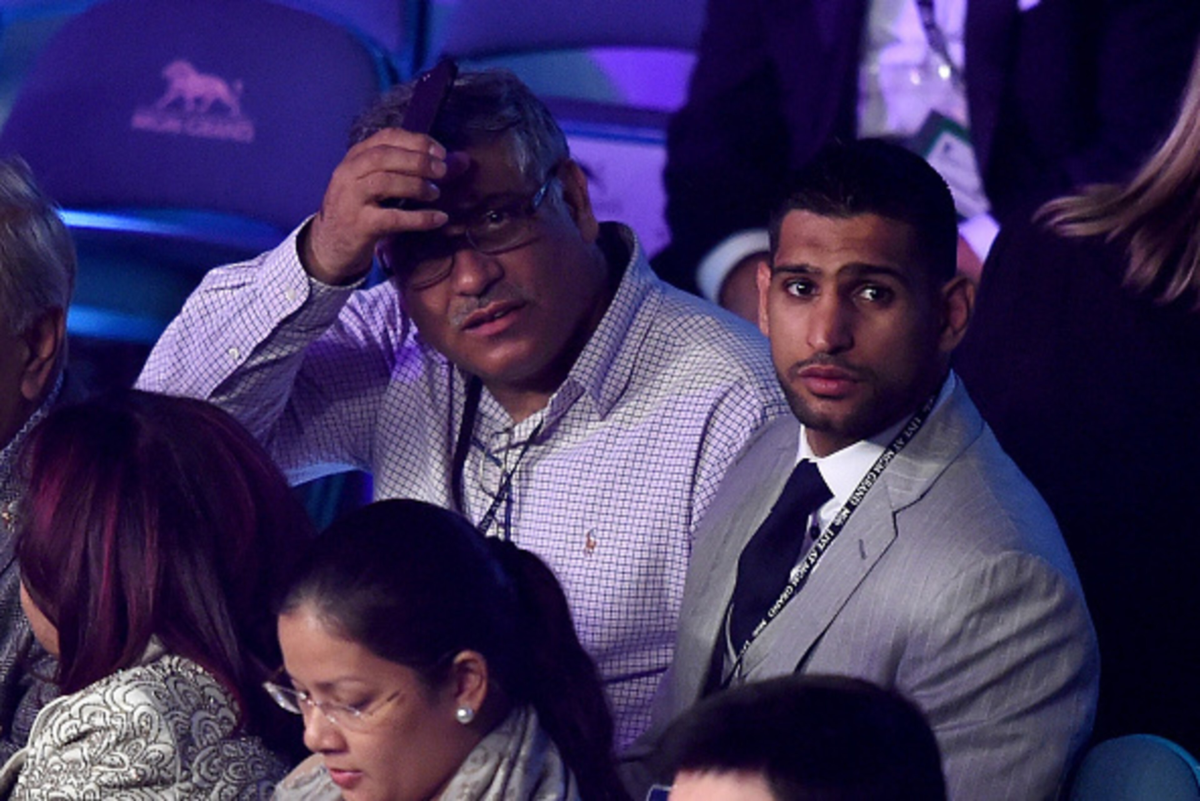 LAS VEGAS, NV - MAY 02:  Boxer Amir Khan (R) watches the Leo Santa Cruz against Jose Cayetano featherweight bout on May 2, 2015 at MGM Grand Garden Arena in Las Vegas, Nevada.  (Photo by Harry How/Getty Images)