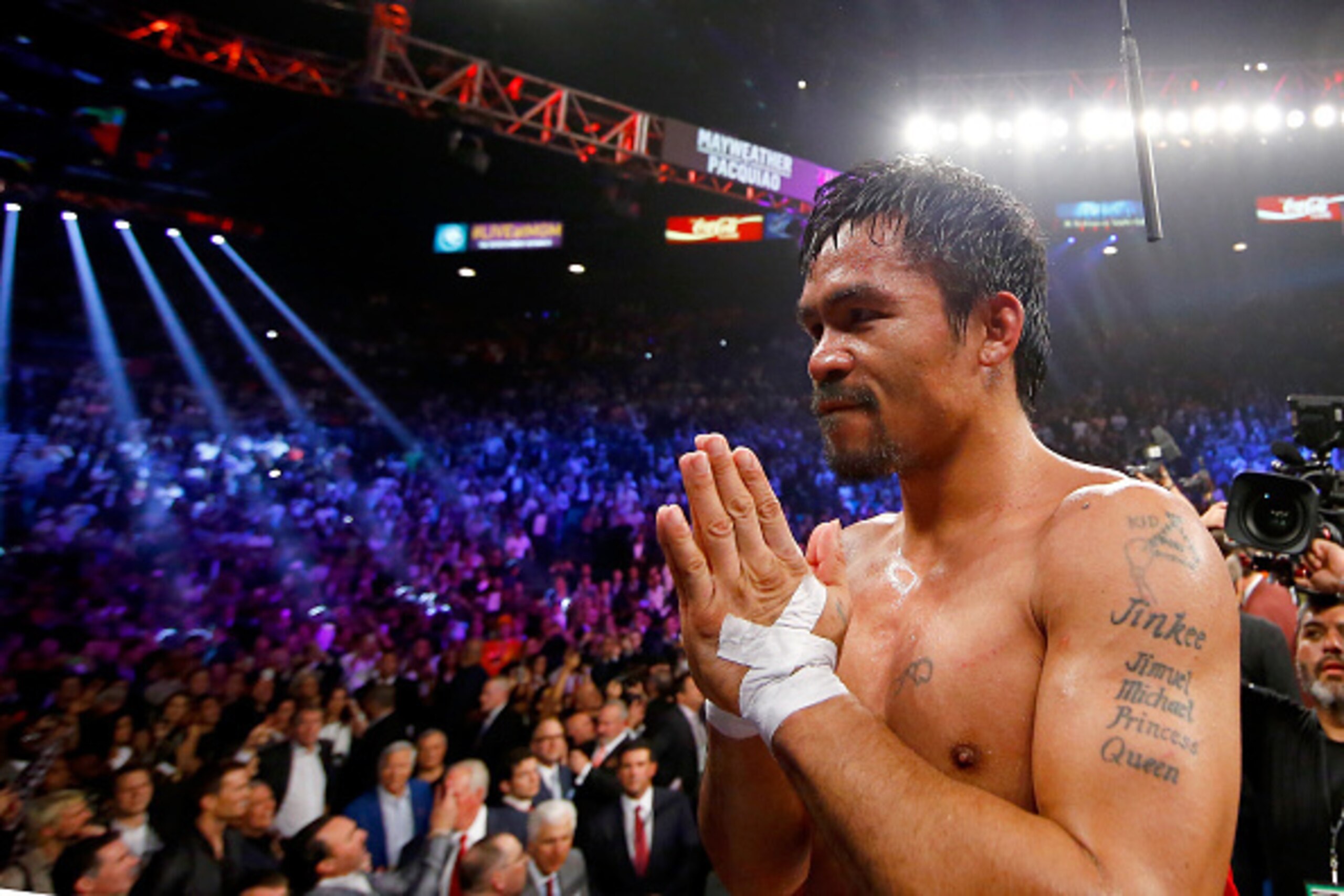 LAS VEGAS, NV - MAY 02:  Manny Pacquiao gestures to the crowd after losing to Floyd Mayweather Jr. in their welterweight unification championship bout on May 2, 2015 at MGM Grand Garden Arena in Las Vegas, Nevada.  (Photo by Al Bello/Getty Images)