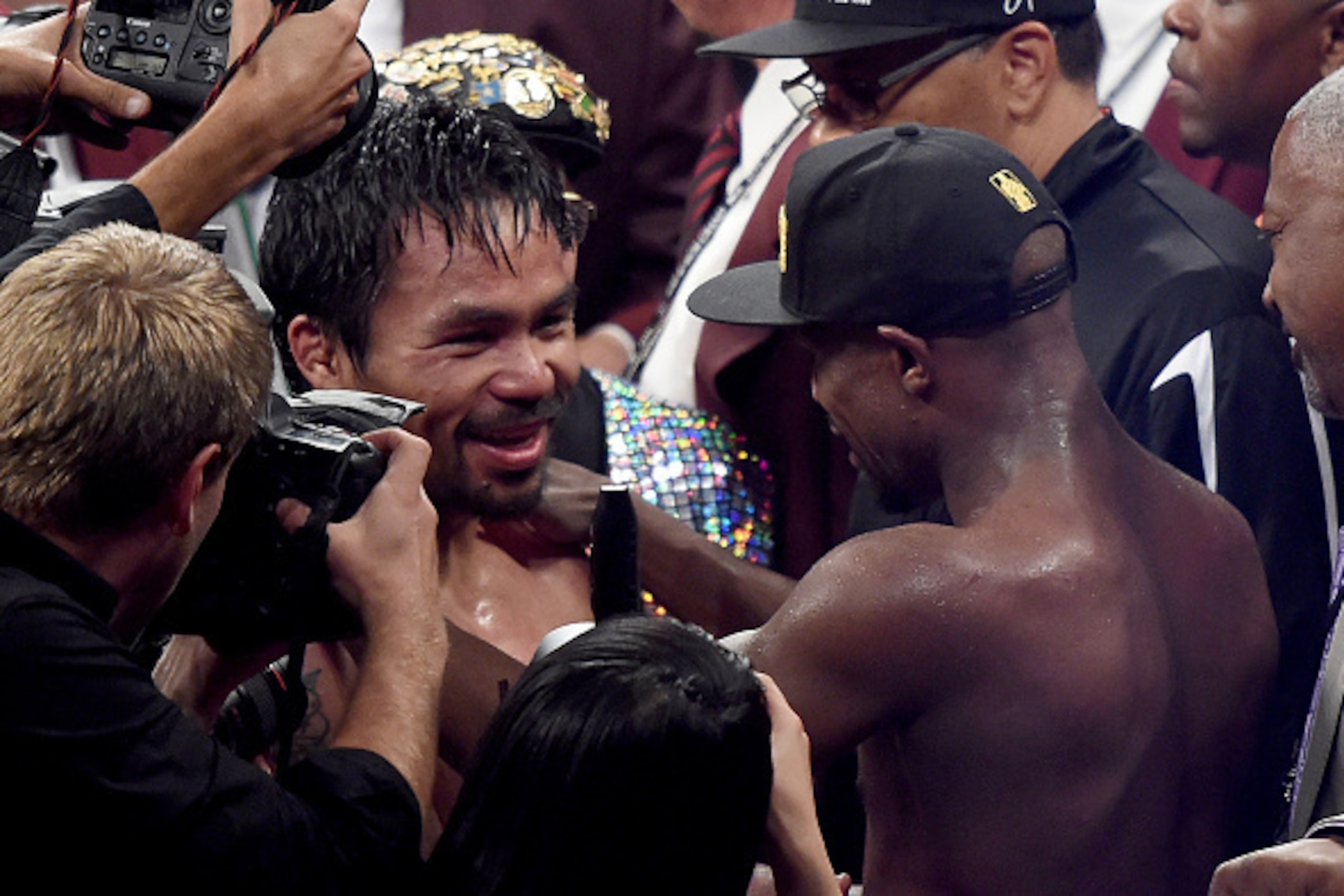 LAS VEGAS, NV - MAY 02:  Floyd Mayweather Jr. hug Manny Pacquiao after the welterweight unification championship bout on May 2, 2015 at MGM Grand Garden Arena in Las Vegas, Nevada.  (Photo by Harry How/Getty Images)