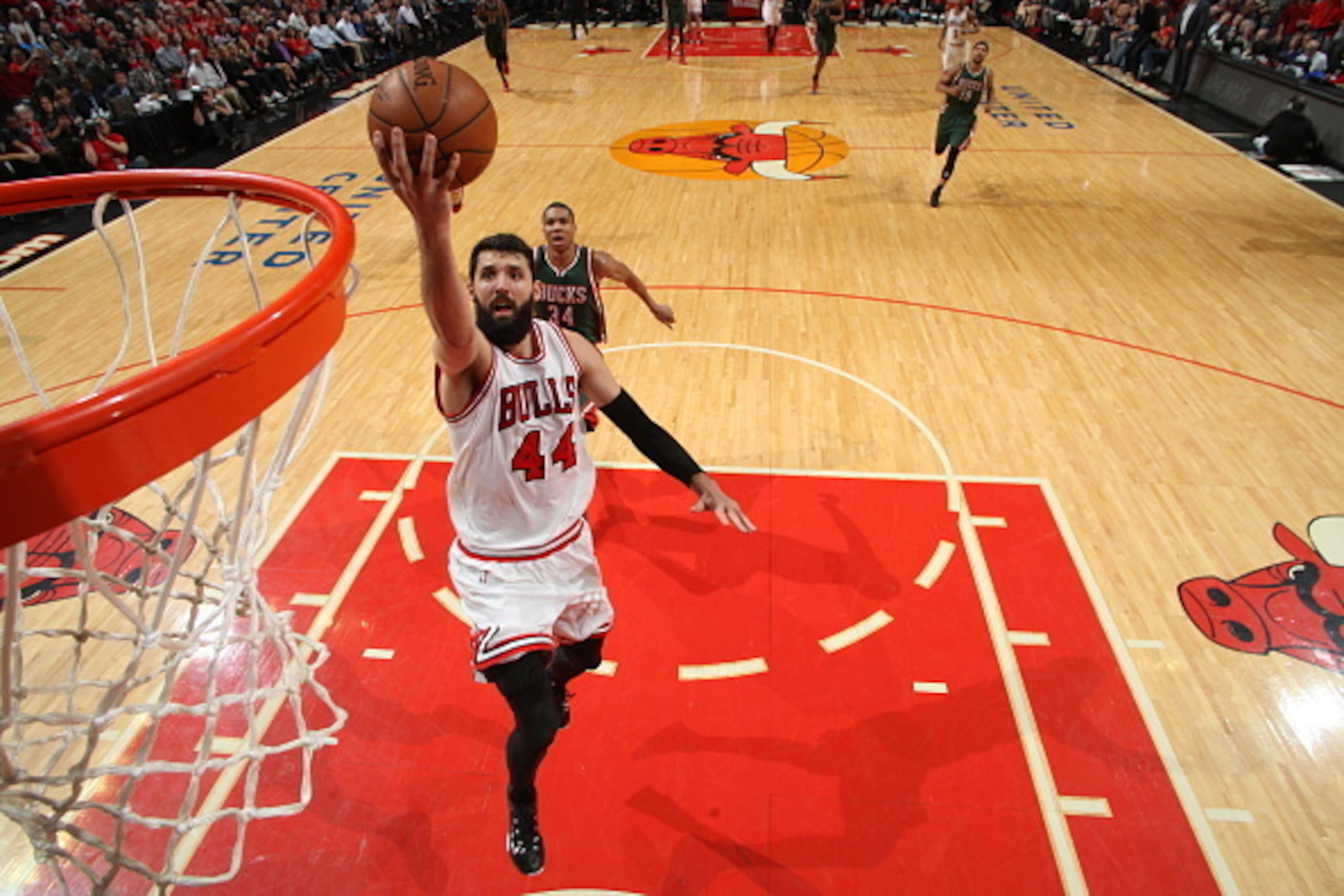 CHICAGO, IL - APRIL 20:  Nikola Mirotic #44 of the Chicago Bulls goes to the basket against the Milwaukee Bucks in Game Two of the Eastern Conference Quarterfinals during the NBA Playoffs on April 20, 2015 at the United Center in Chicago, Illinois. NOTE T