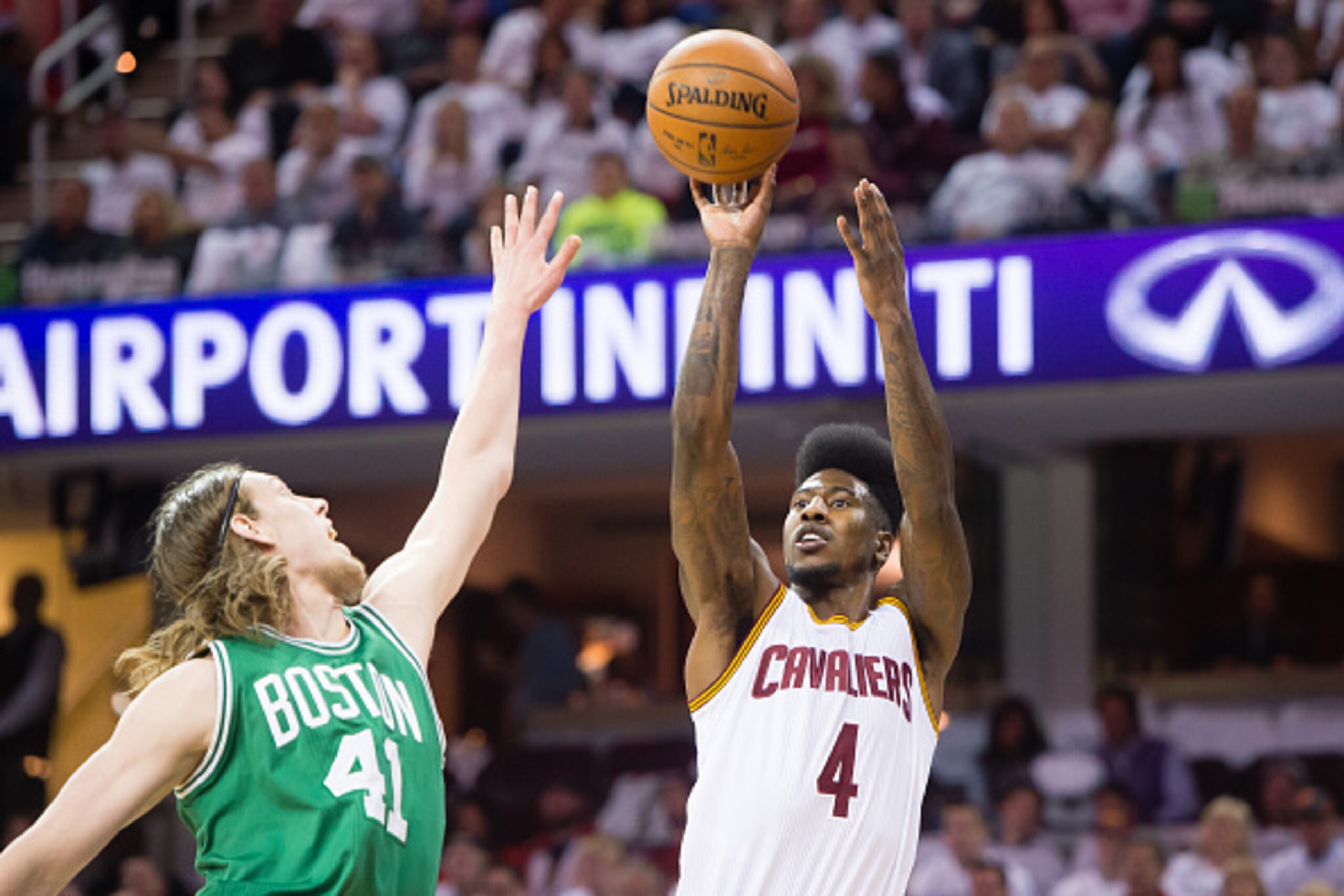 CLEVELAND, OH - APRIL 21: Kelly Olynyk #41 of the Boston Celtics tries to block Iman Shumpert #4 of the Cleveland Cavaliers in the first half during Game Two in the Eastern Conference Quarterfinals of the 2015 NBA Playoffs at Quicken Loans Arena on April 