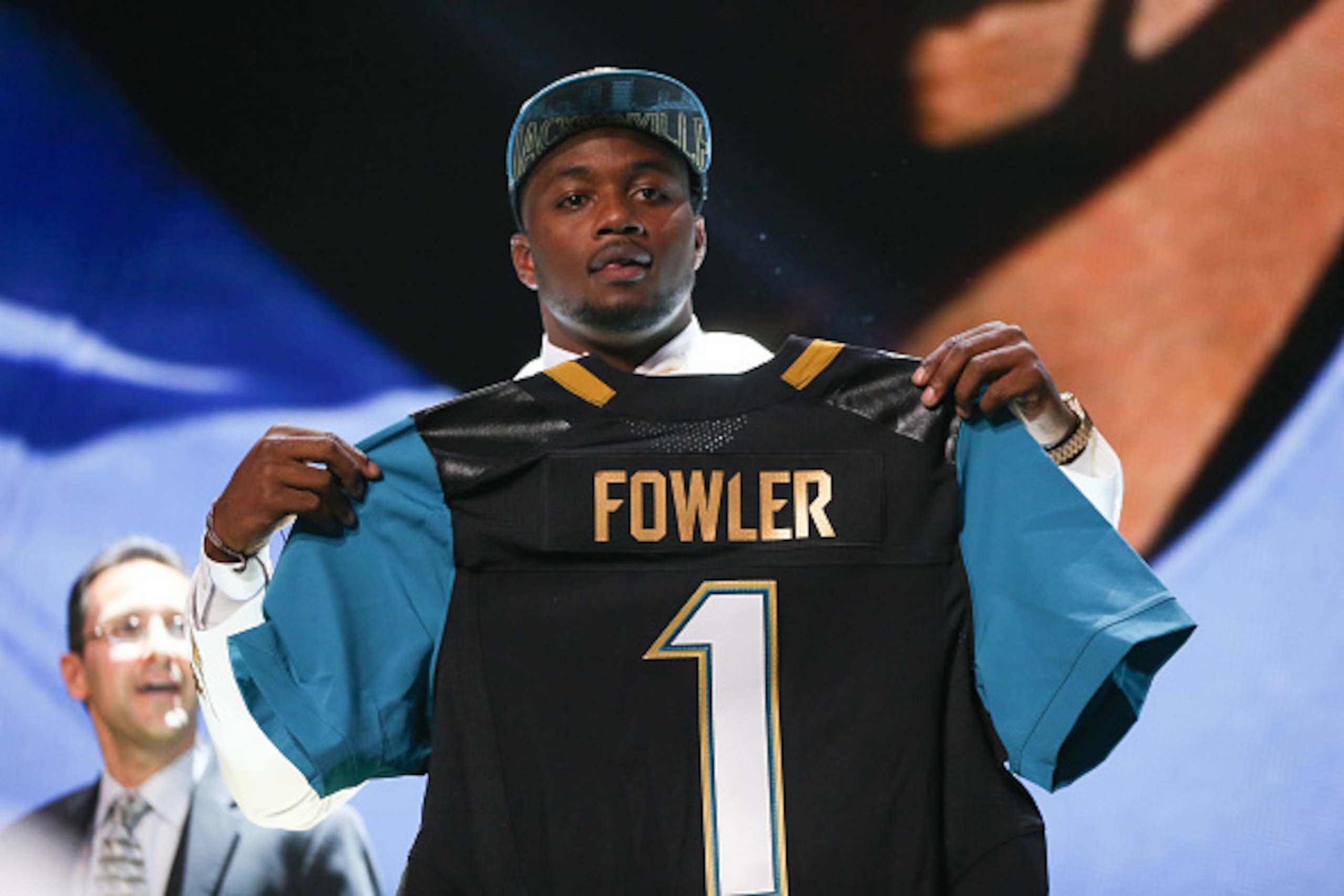 CHICAGO, IL - APRIL 30:  Dante Fowler Jr. of the Florida Gators holds up a jersey after being chosen #3 overall by the Jacksonville Jaguars during the first round of the 2015 NFL Draft at the Auditorium Theatre of Roosevelt University on April 30, 2015 in