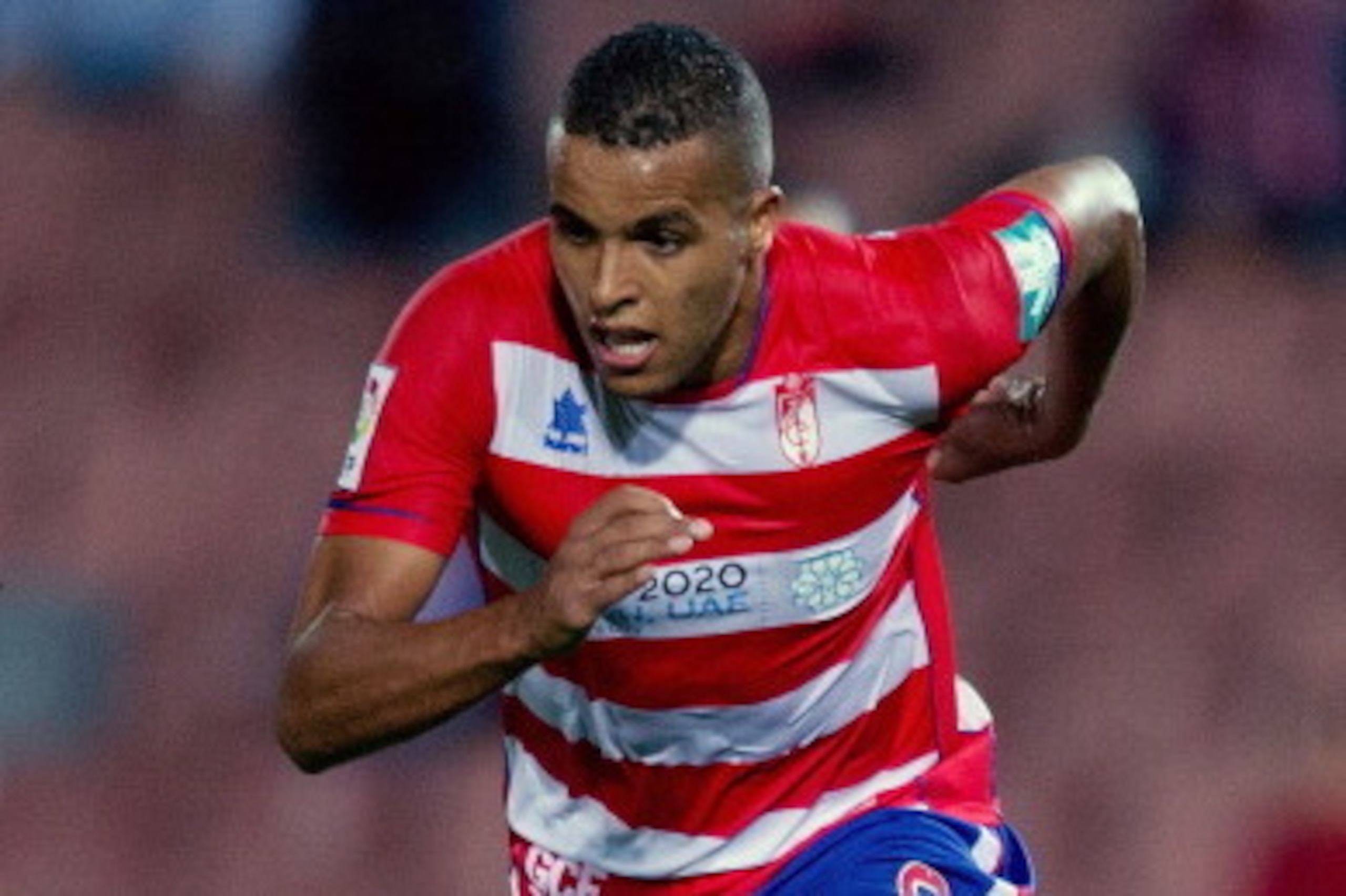 GRANADA, SPAIN - SEPTEMBER 30:  Youssef El-Arabi of Granada CF runs for the ball during the La Liga match between Granada CF and Athletic Club at Estadio Nuevo Los Carmenes on September 30, 2013 in Granada, Spain.  (Photo by Gonzalo Arroyo Moreno/Getty Im