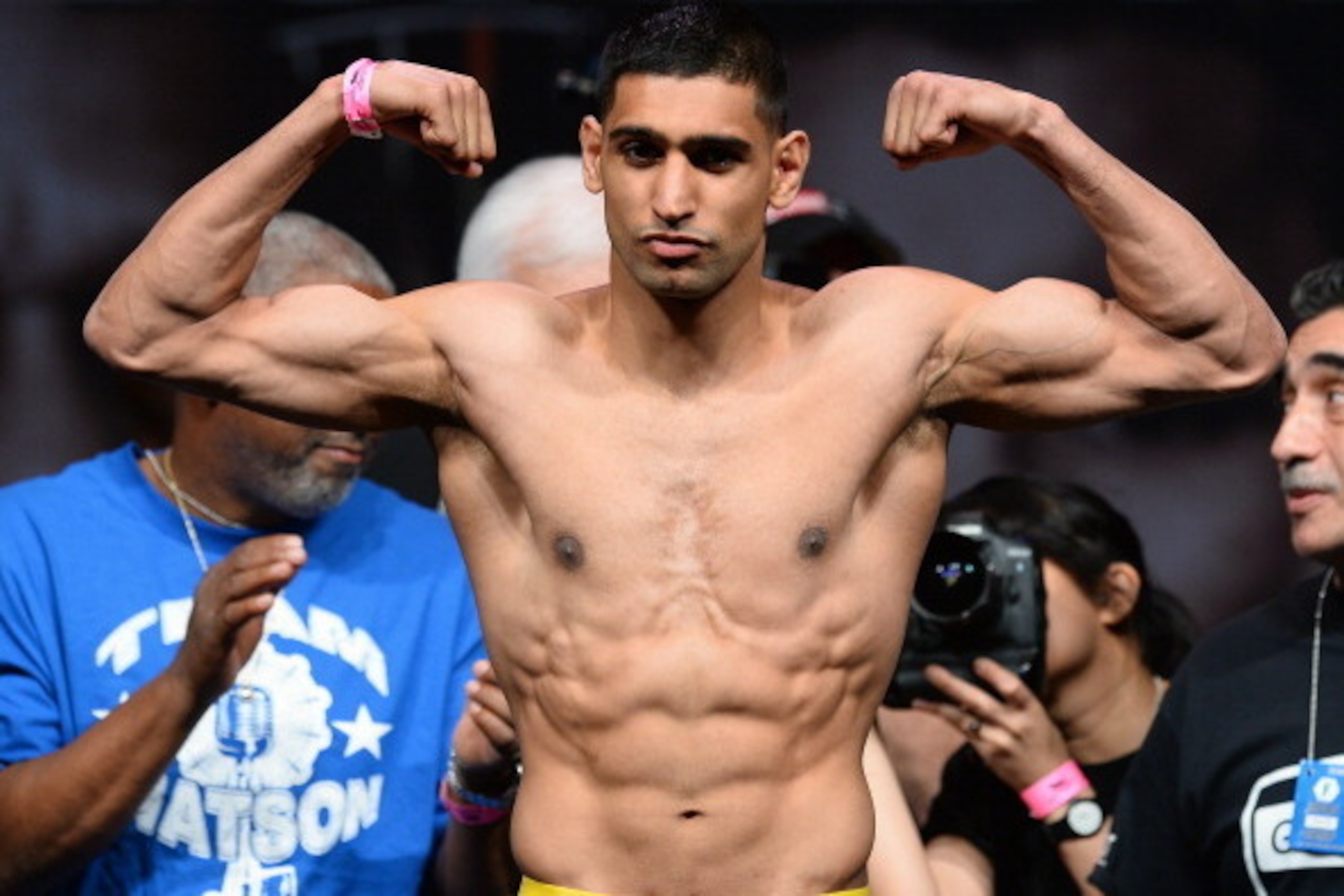LAS VEGAS, NV - MAY 02:  Boxer Amir Khan poses on the scale during his official weigh-in at the MGM Grand Garden Arena on May 2, 2014 in Las Vegas, Nevada. Khan will meet Luis Collazo in a welterweight bout on May 3.  (Photo by Ethan Miller/Getty Images)