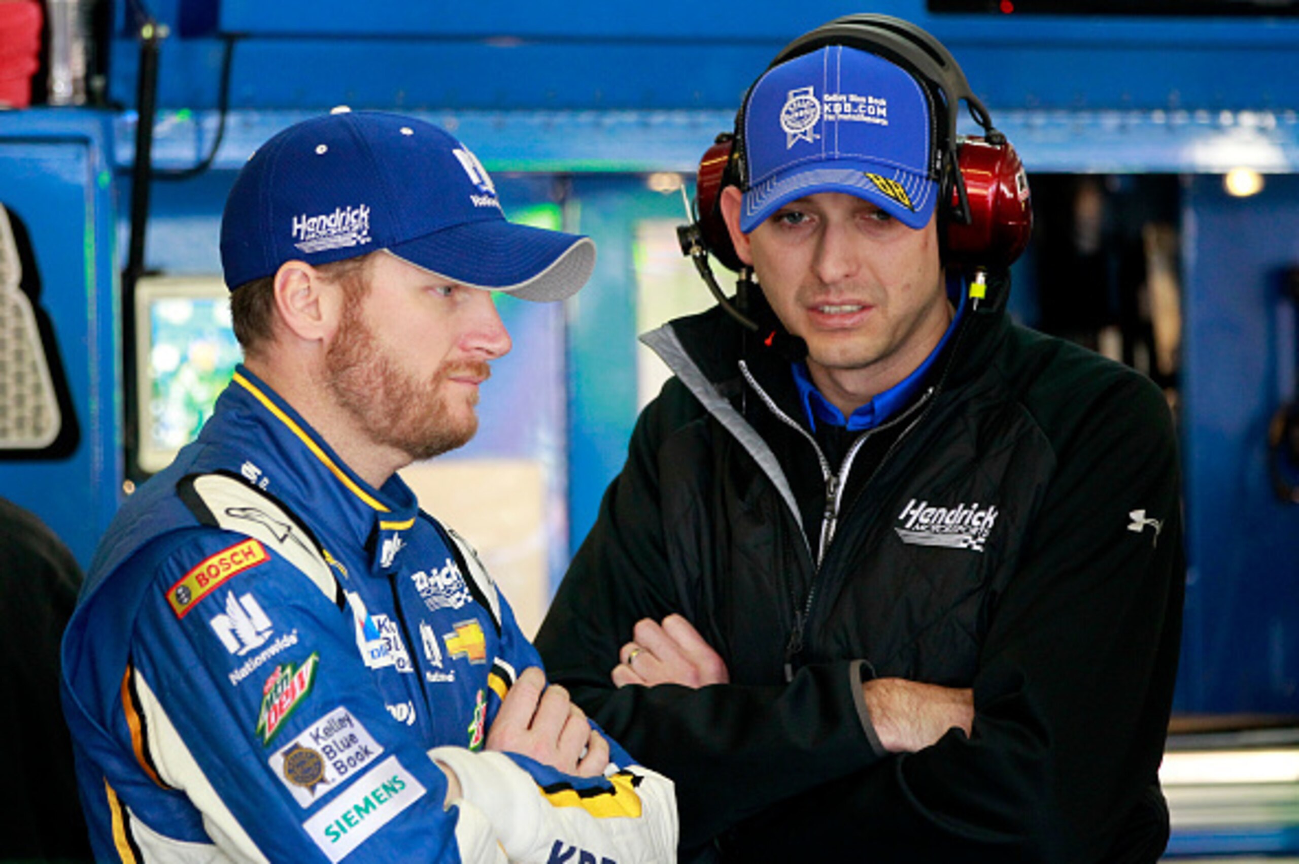 HAMPTON, GA - FEBRUARY 27: Dale Earnhardt Jr., driver of the #88 Kelley Blue Book Chevrolet, talks to his crew chief, Greg Ives, during practice for the NASCAR Sprint Cup Series  Folds of Honor QuikTrip 500 at Atlanta Motor Speedway on February 27, 2015 i