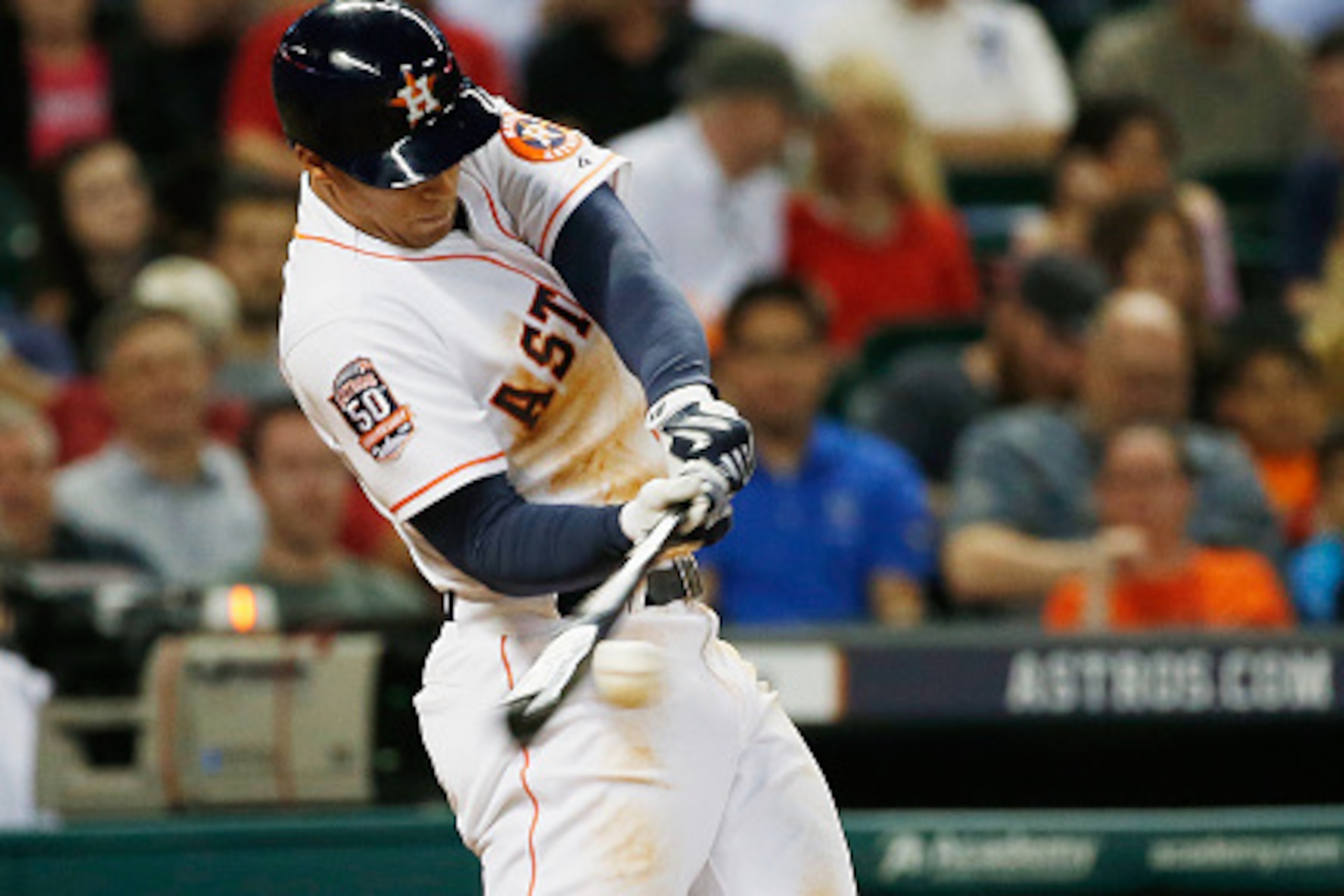 HOUSTON, TX - APRIL 14:  George Springer #4 of the Houston Astros swings at a pitch in the third inning of their game against the Oakland Athletics at Minute Maid Park on April 14, 2015 in Houston, Texas.  (Photo by Scott Halleran/Getty Images)