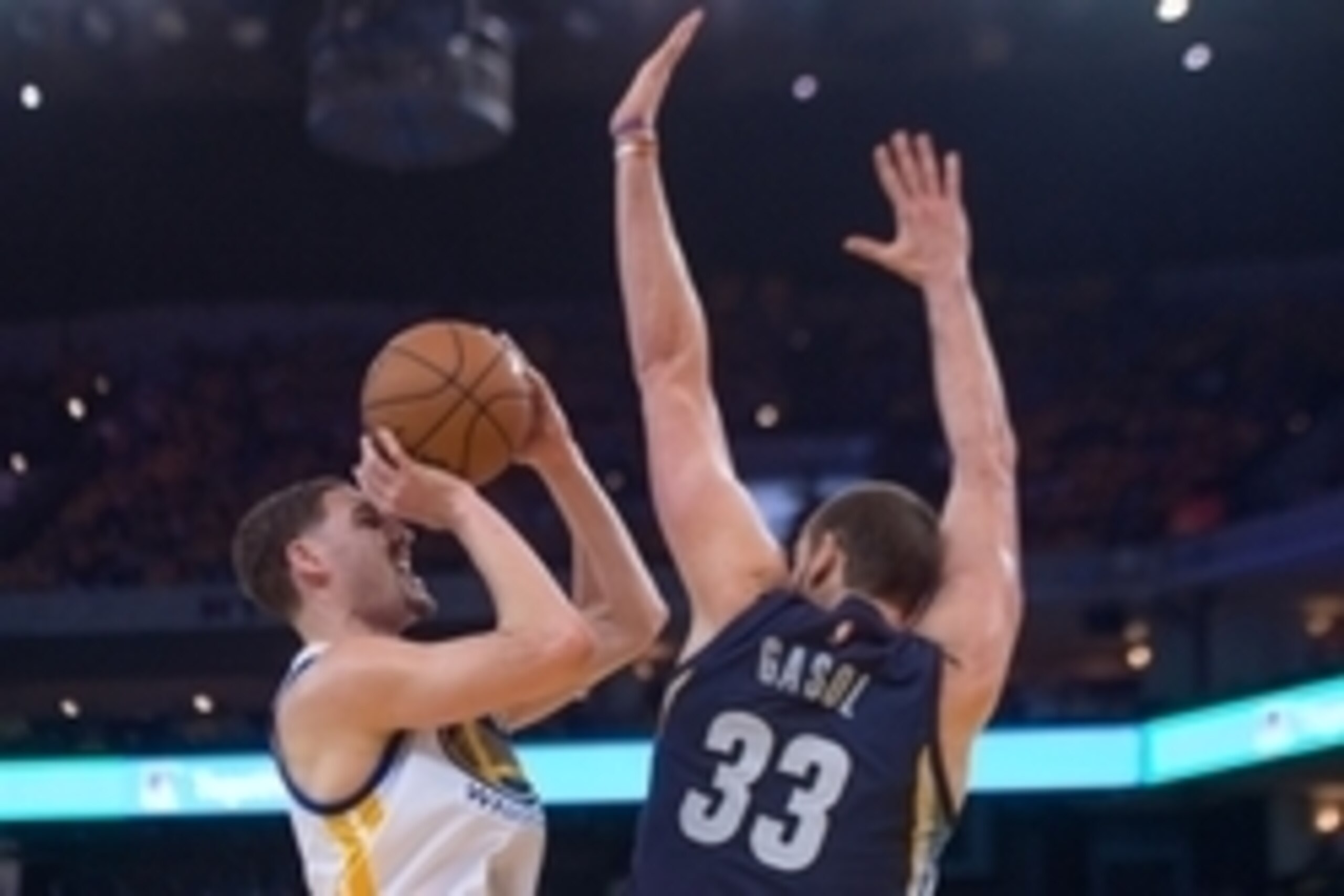 May 3, 2015; Oakland, CA, USA; Golden State Warriors guard Klay Thompson (11) shoots the basketball against Memphis Grizzlies center Marc Gasol (33) during the third quarter in game one of the second round of the NBA Playoffs at Oracle Arena. The Warriors