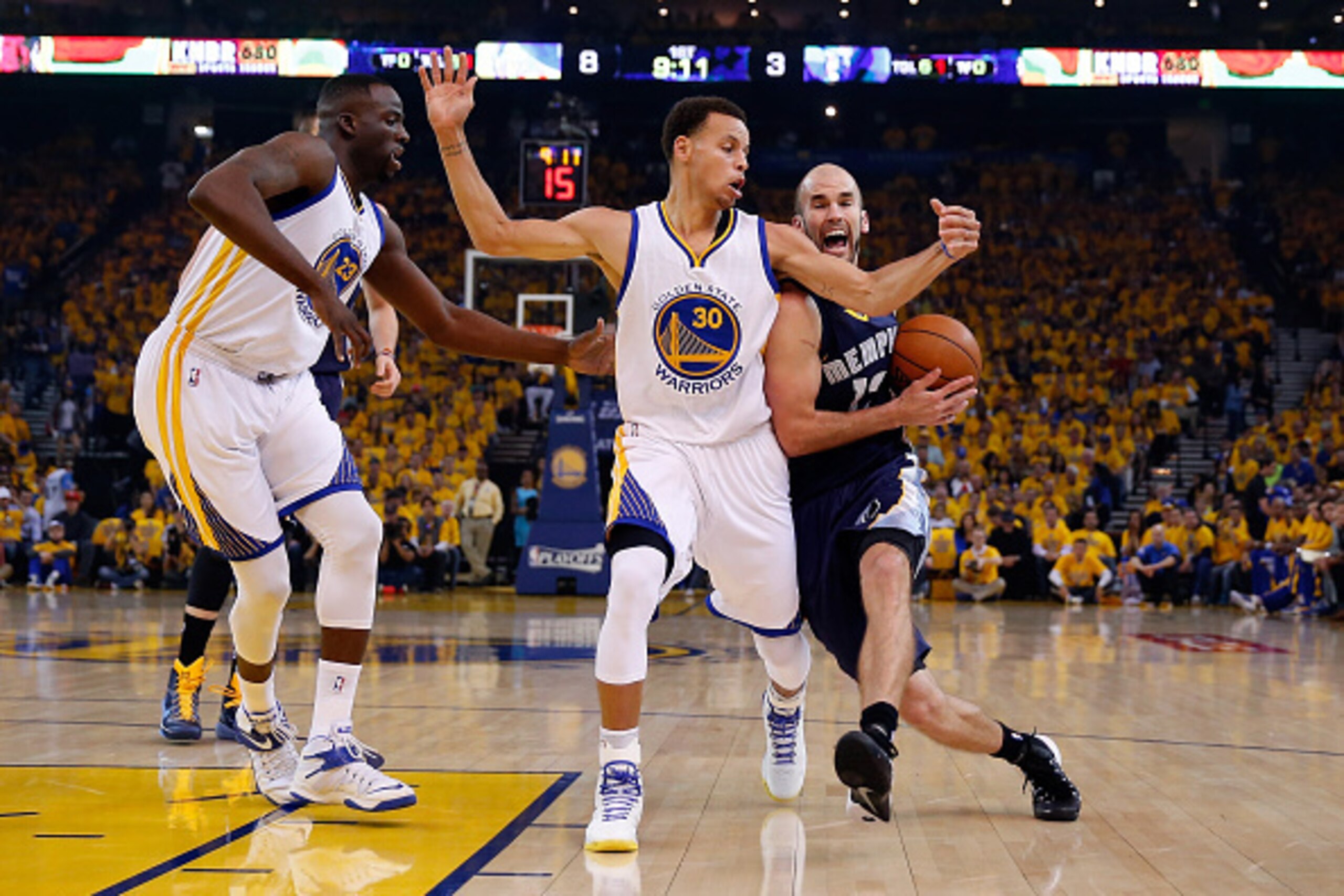 OAKLAND, CA - MAY 03:  Nick Calathes #12 of the Memphis Grizzlies is covered by Stephen Curry #30 and Draymond Green #23 of the Golden State Warriors during Game One of the Western Conference Semifinals during the NBA Playoffs on May 3, 2015 at Oracle Are
