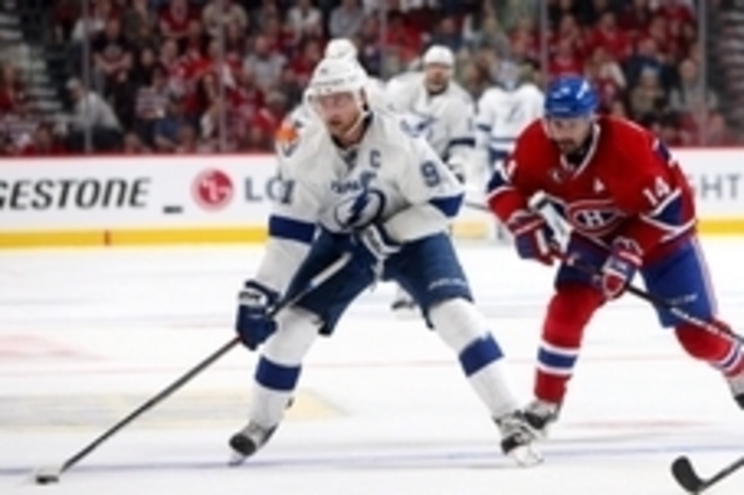 May 3, 2015; Montreal, Quebec, CAN; Tampa Bay Lightning center Steven Stamkos (91) plays the puck against Montreal Canadiens center Tomas Plekanec (14) during the second period in game two of the second round of the 2015 Stanley Cup Playoffs at Bell Centr