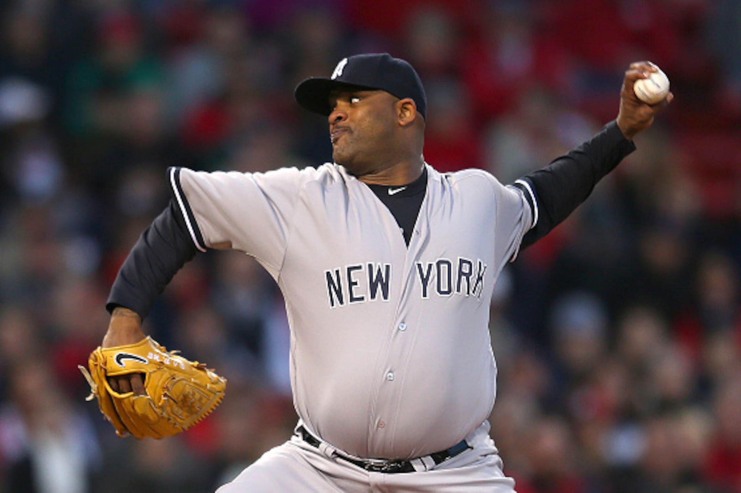 BOSTON, MA - MAY 1:  CC Sabathia #52 of the New York Yankees throws against the Boston Red Sox in the second inning at Fenway Park May 1, 2015 in Boston, Massachusetts.  (Photo by Jim Rogash/Getty Images)