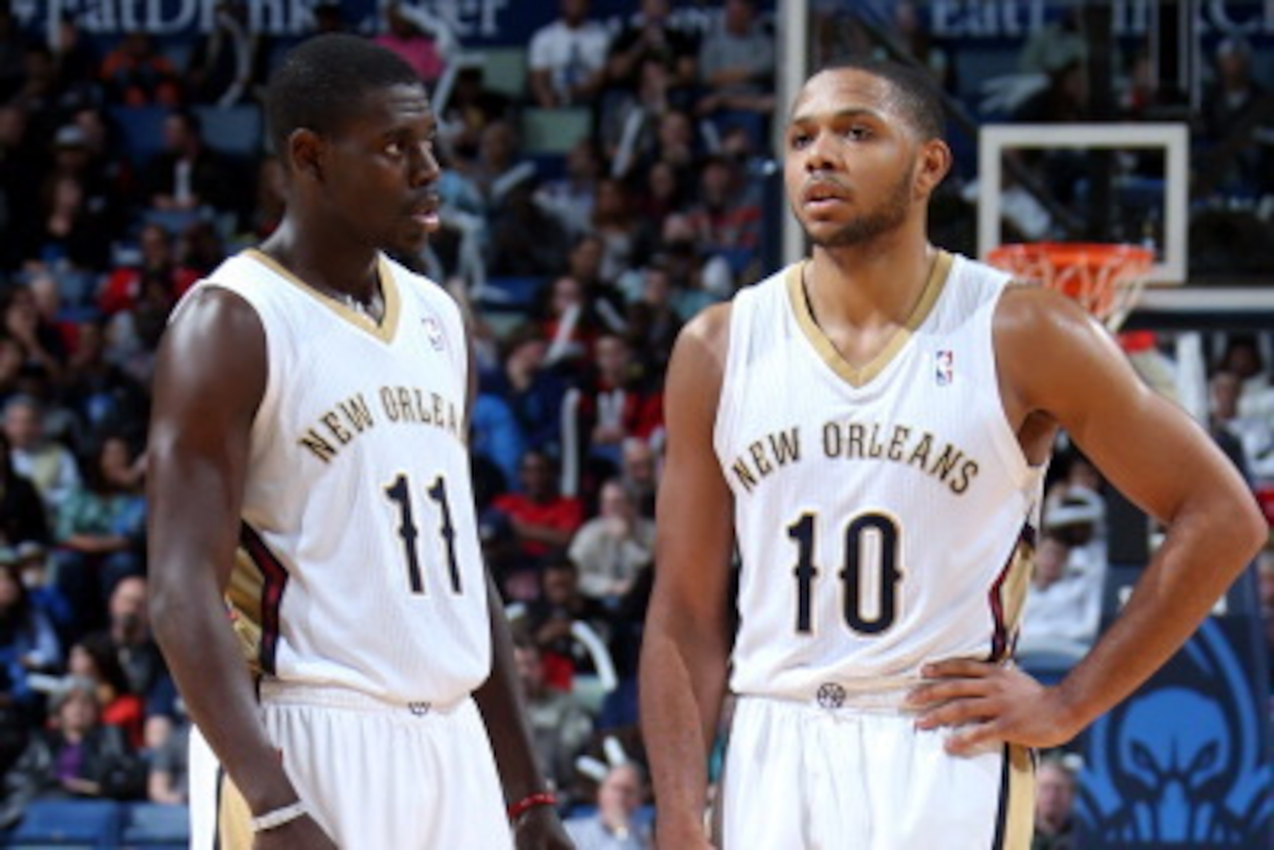 NEW ORLEANS, LA - DECEMBER 06: Jrue Holiday #11 and Eric Gordon #10 of the New Orleans Pelicans look on against the Oklahoma City Thunder during an NBA game on December 6, 2013 at the New Orleans Arena in New Orleans, Louisiana. NOTE TO USER: User express
