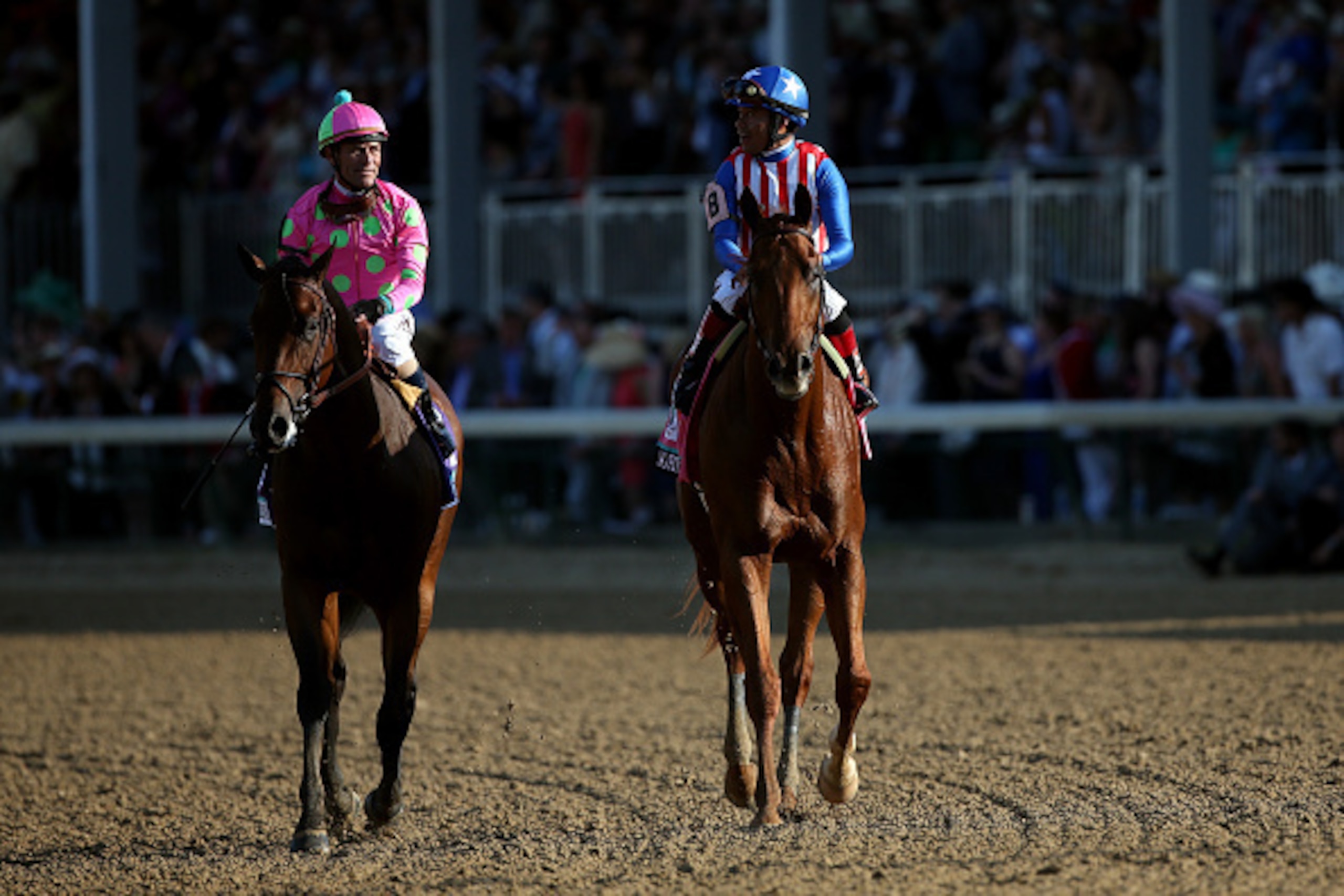 LOUISVILLE, KY - MAY 02:  Jockey Martin Garcia atop of Dortmund #8 talks with Jockey Gary Stevens atop Firing Line #10 after placing second and thrid in the 141st running of the Kentucky Derby at Churchill Downs on May 2, 2015 in Louisville, Kentucky.  (P