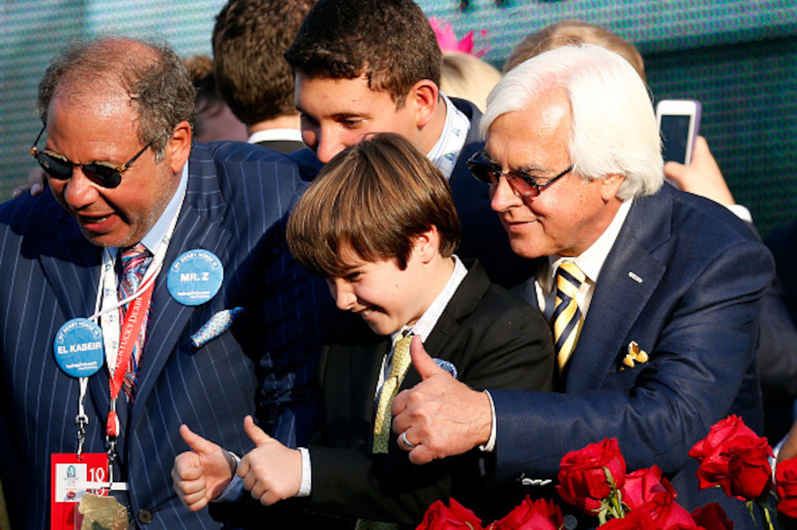 LOUISVILLE, KY - MAY 02:  Trainer Bob Baffert of American Pharoah #18 celebrates with his son Bode and Owner Ahmed Zayat in winners circle after winning the 141st running of the Kentucky Derby at Churchill Downs on May 2, 2015 in Louisville, Kentucky.  (P
