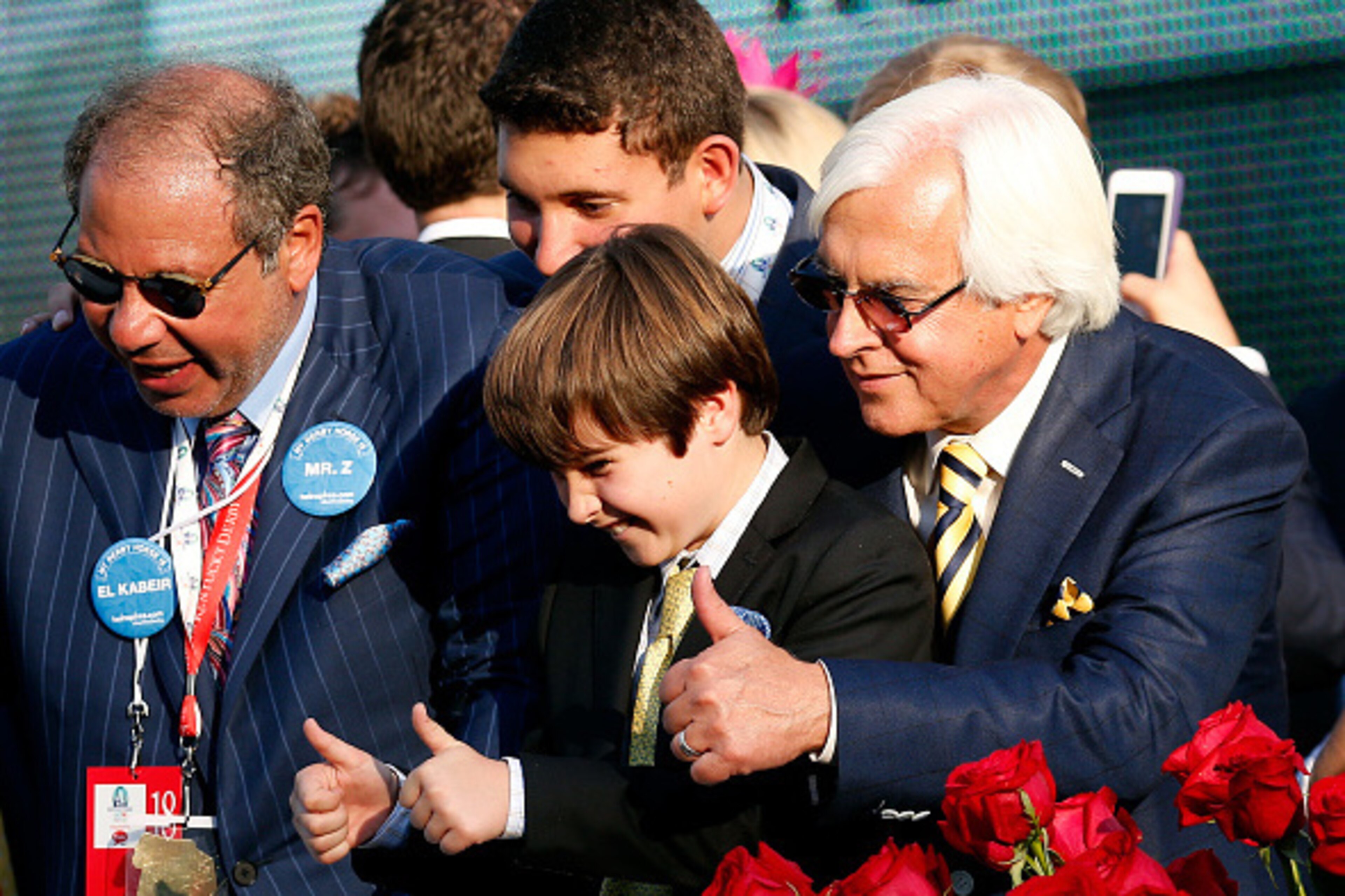 LOUISVILLE, KY - MAY 02:  Trainer Bob Baffert of American Pharoah #18 celebrates with his son Bode and Owner Ahmed Zayat in winners circle after winning the 141st running of the Kentucky Derby at Churchill Downs on May 2, 2015 in Louisville, Kentucky.  (P