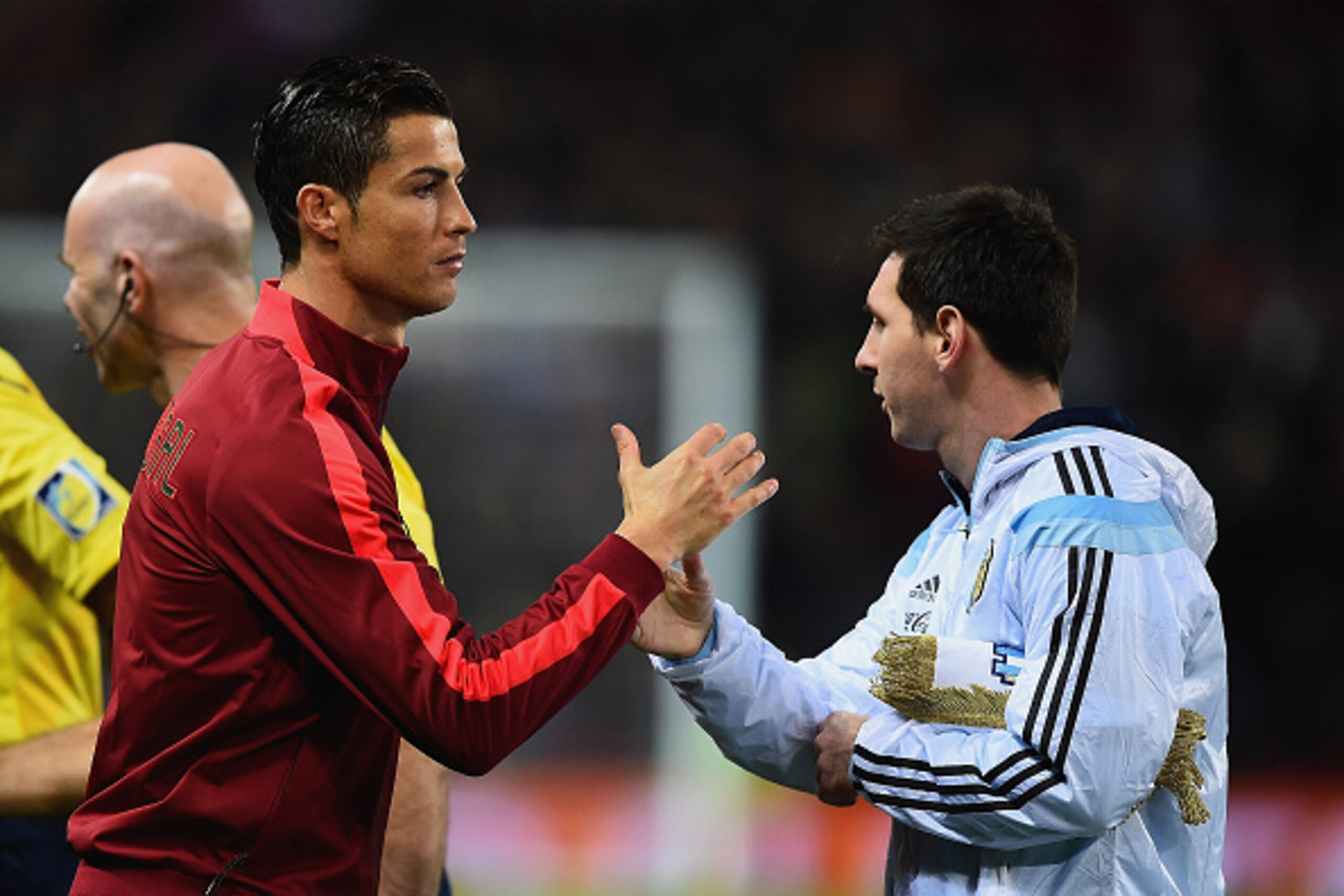 MANCHESTER, ENGLAND - NOVEMBER 18:  Cristiano Ronaldo of Portugal shakes hands with Lionel Messi of Argentina prior to the International Friendly between Argentina and Portugal at Old Trafford on November 18, 2014 in Manchester, England.  (Photo by Lauren